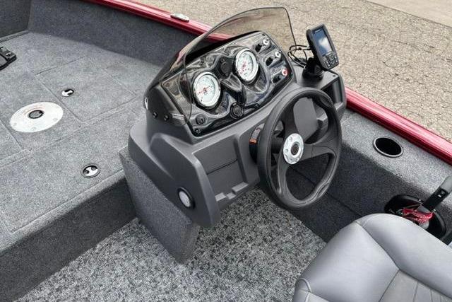 2025 Tracker Super Guide V-16 SC boat dashboard with steering wheel and gauges.