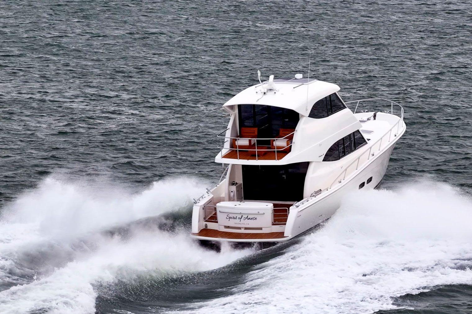 2014 Maritimo M50 yacht cruising through ocean waves.