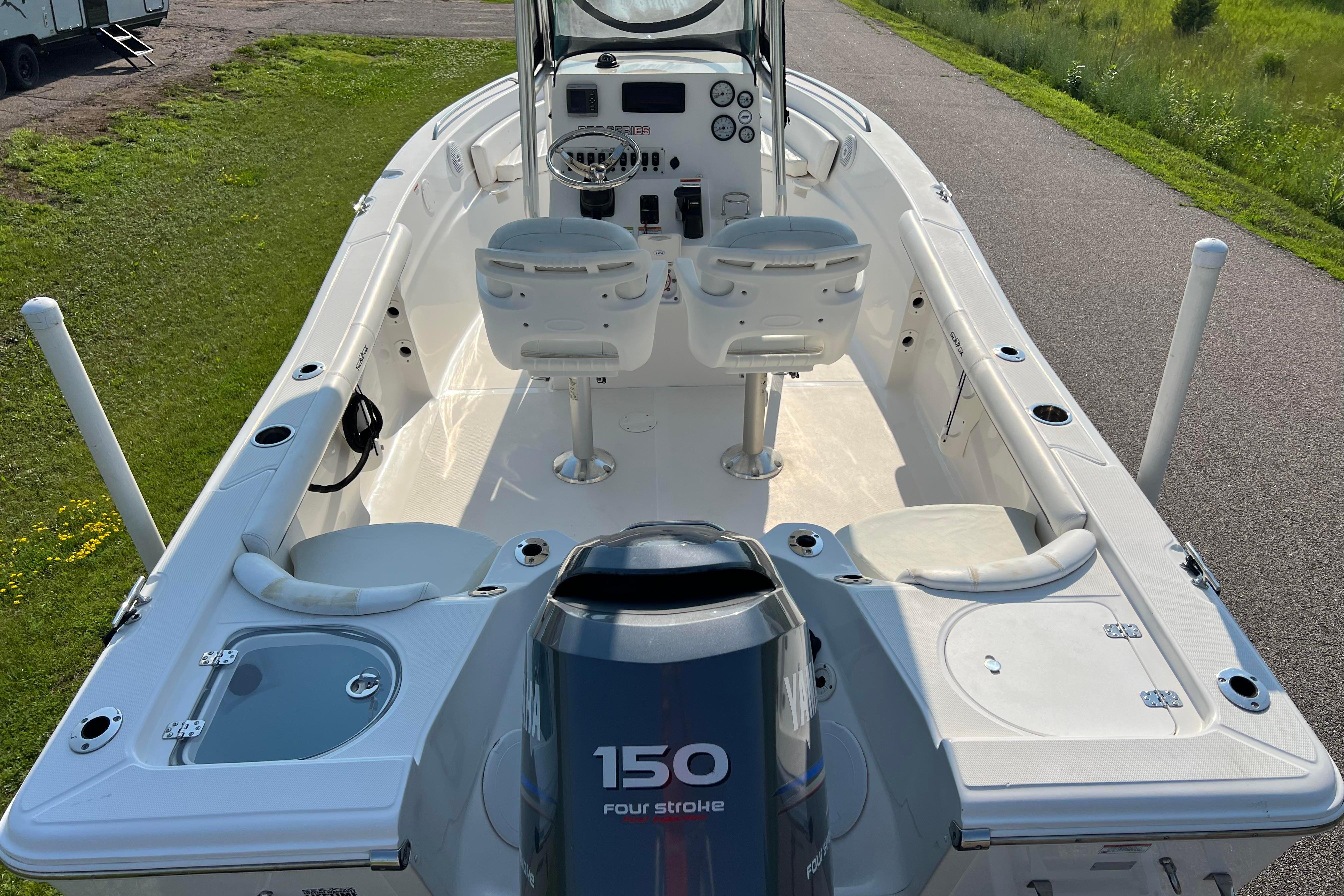 2012 Sea Fox 206 Center Console boat with Yamaha 150 engine, viewed from the stern.