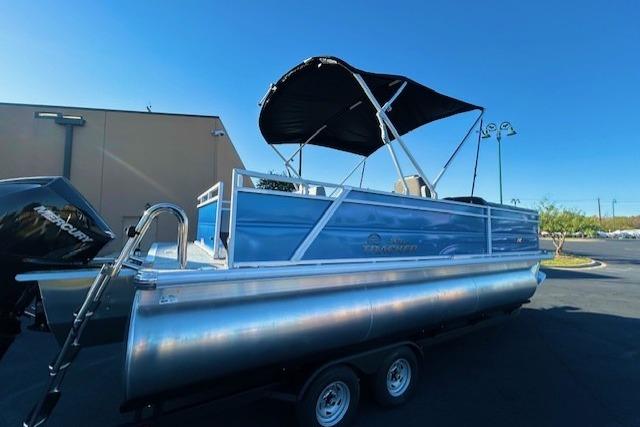 2026 Sun Tracker Party Barge 22 RF XP3 pontoon boat with canopy on trailer.
