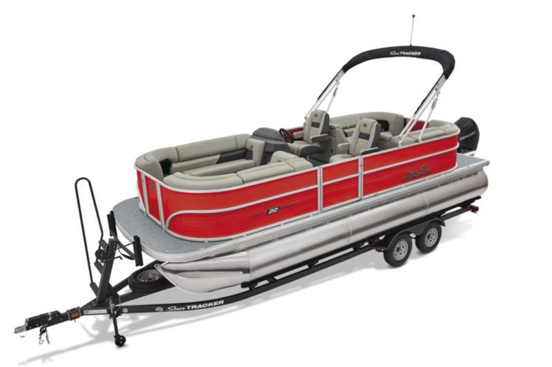 2026 Sun Tracker Party Barge 22 DLX pontoon boat with red exterior on trailer.