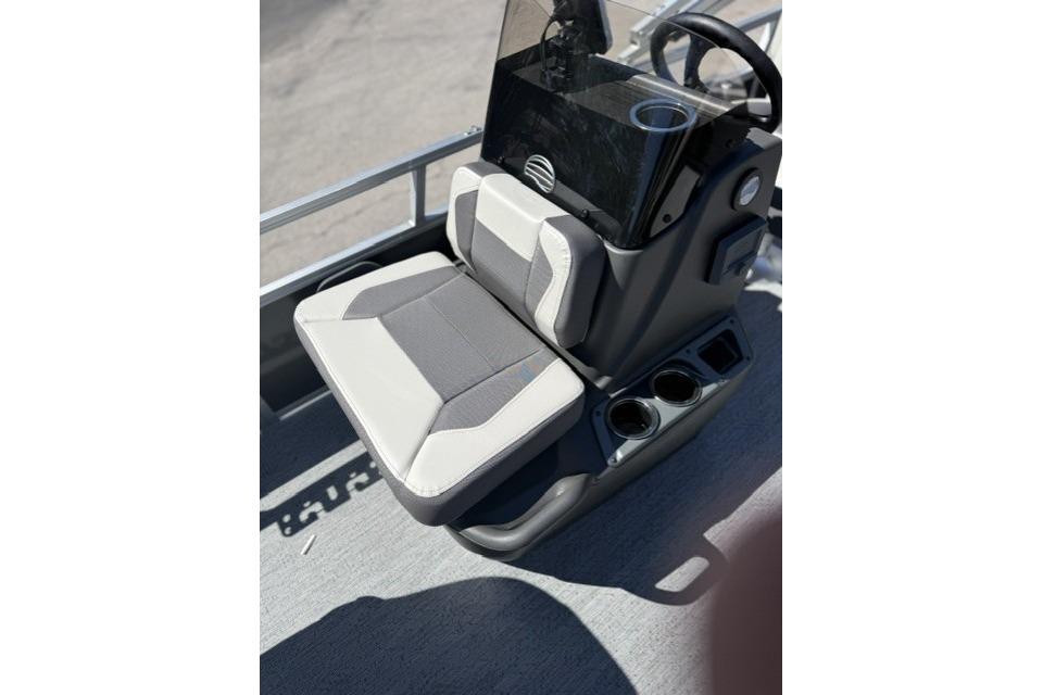 2026 Sun Tracker Bass Buggy 16 XL Select boat seat with console and cup holders.