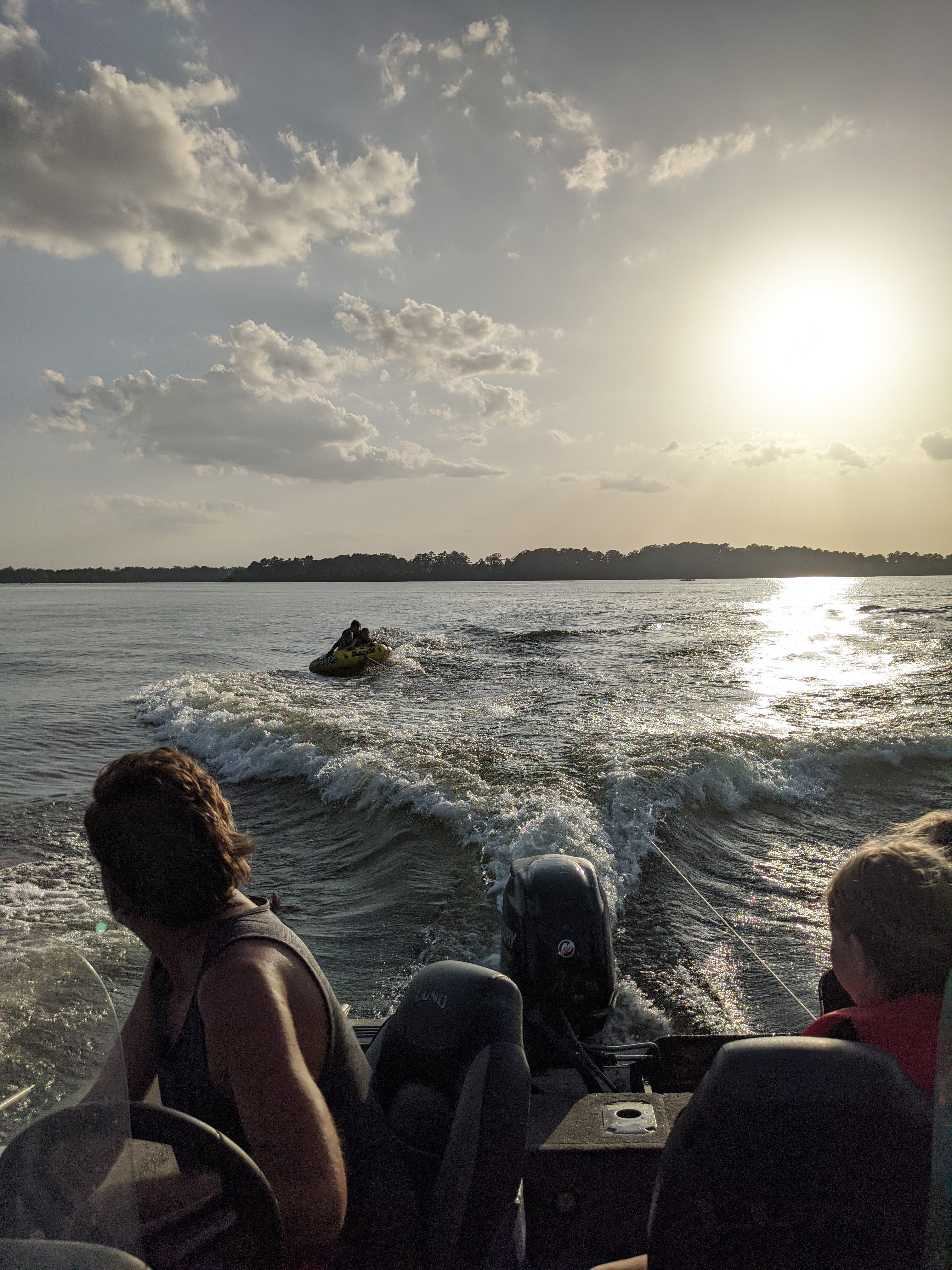 Sunset boating on a 2000 Sea Hunt Escape 200 with jet ski.