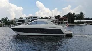 2014 Beneteau Gran Turismo 49 yacht on calm waters.