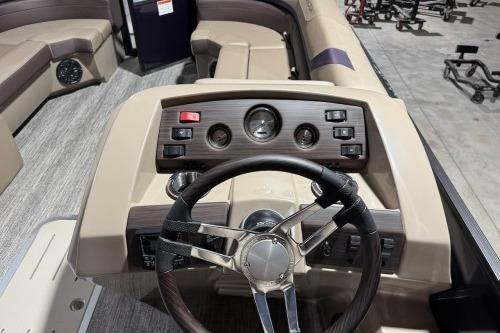 2026 Bennington 22SXSB boat dashboard with steering wheel and control panel.