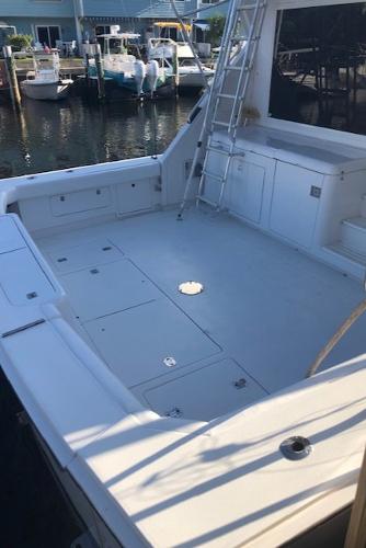 1997 Bertram Convertible boat deck at a marina.
