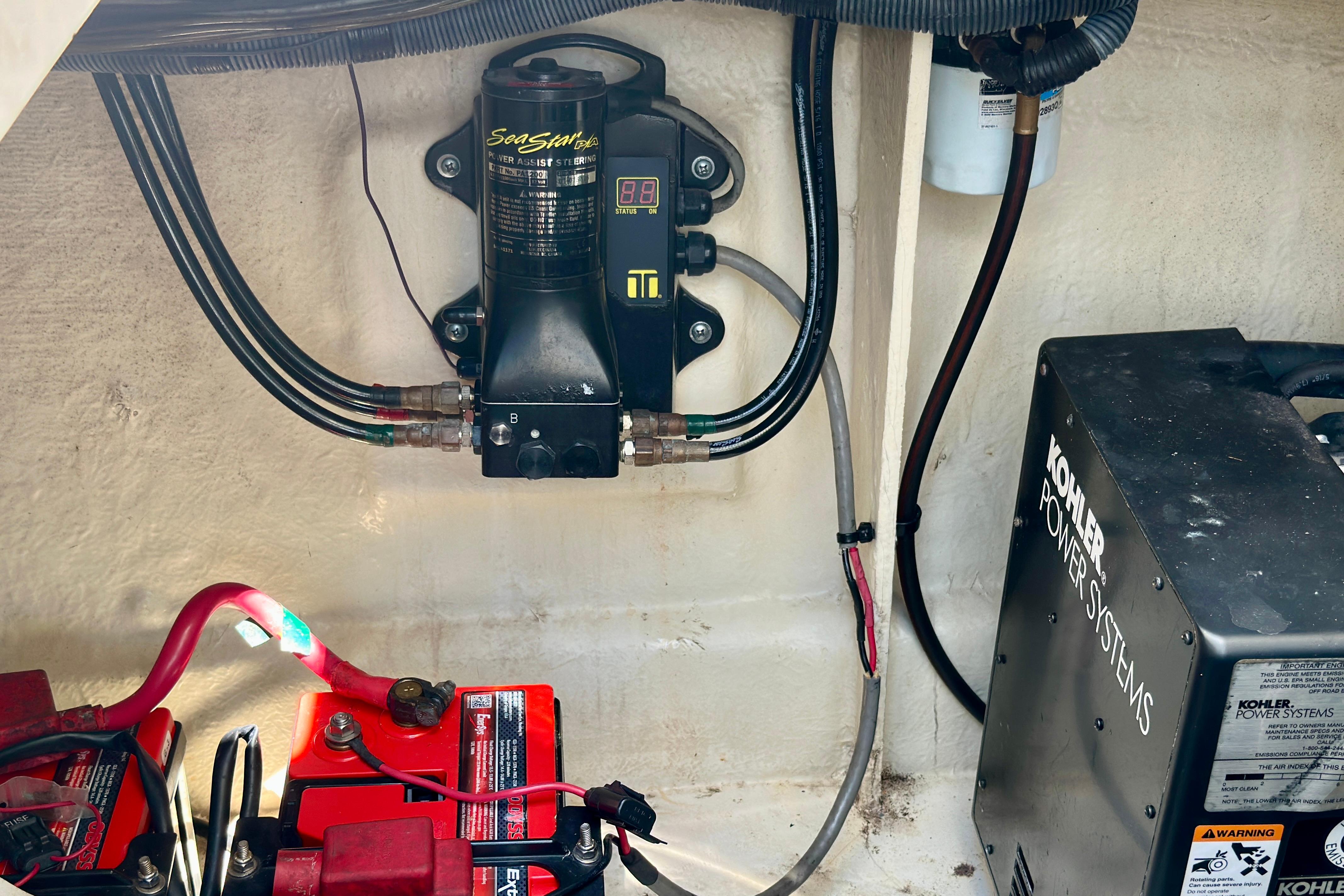 Engine compartment of 2008 Sea Ray 340 Sundancer with Kohler power system and wiring.