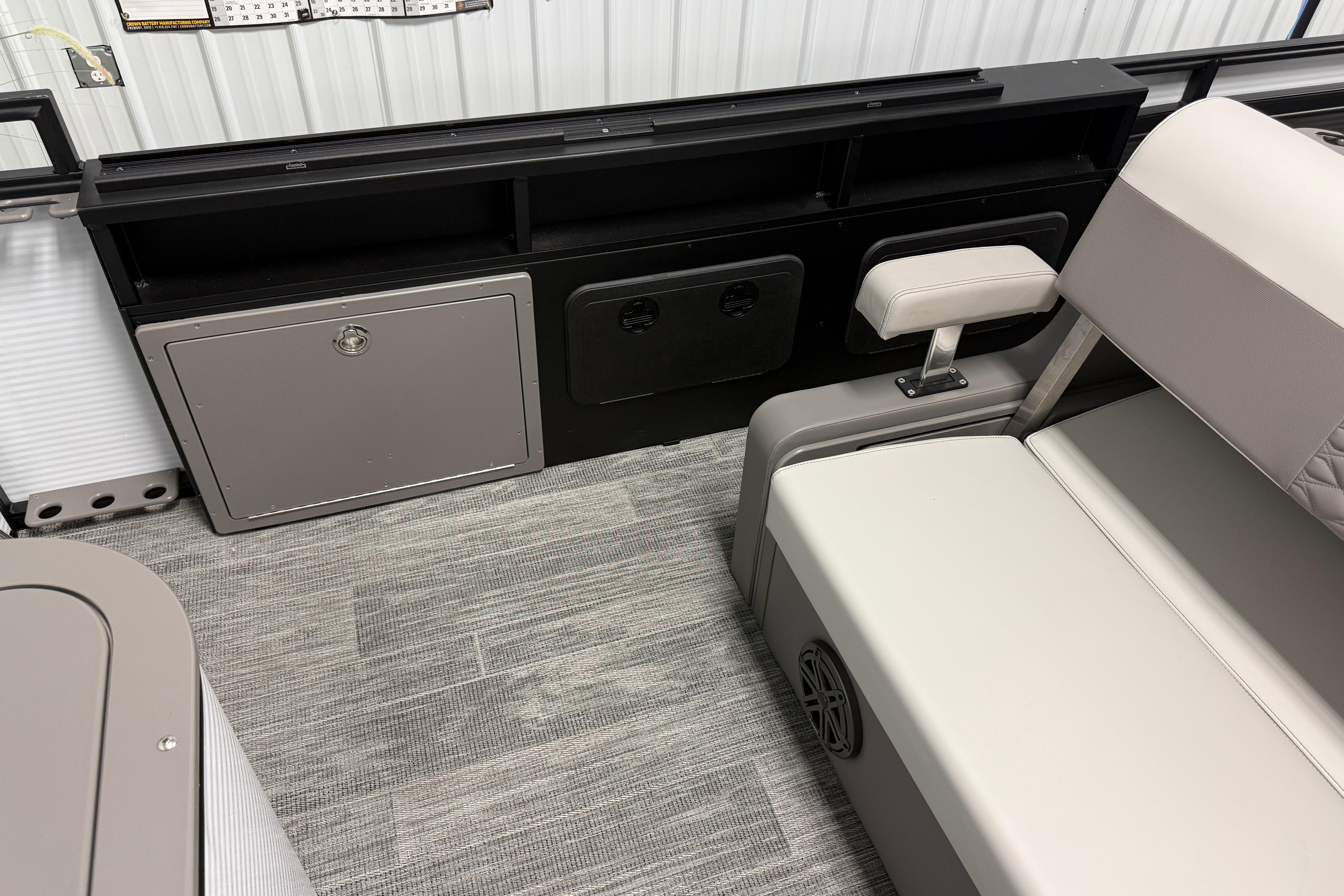 Interior of 2026 Qwest M-Class 22 Pro Sport boat with seating and storage compartments.