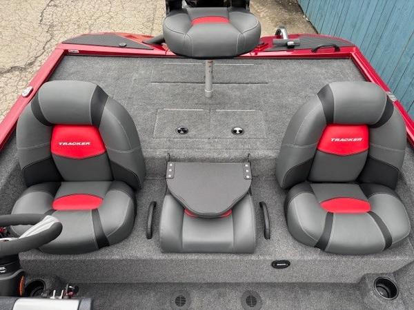 2025 Tracker Savage 215 boat interior with gray and red seating.