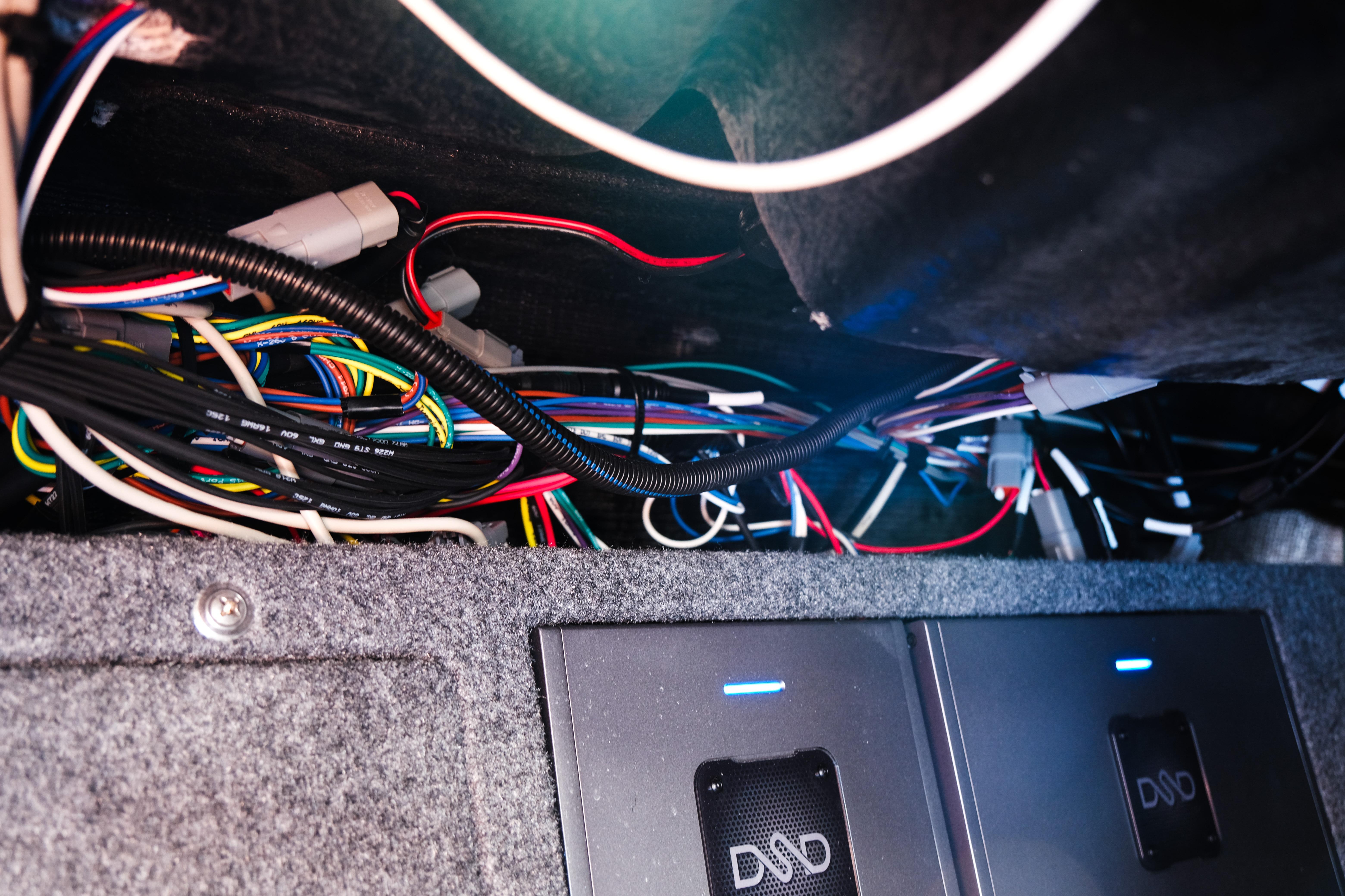 Interior wiring of a 2026 Supra SA450, showcasing complex cable arrangement and electronic components.