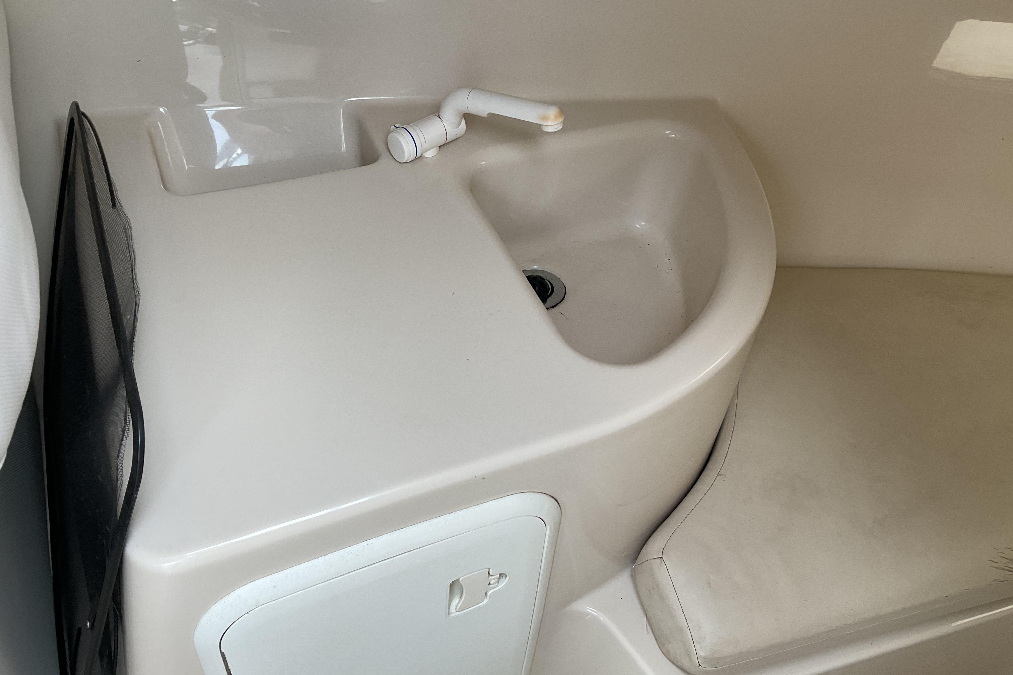Interior sink area of a 2012 Wellcraft 232 Coastal boat.
