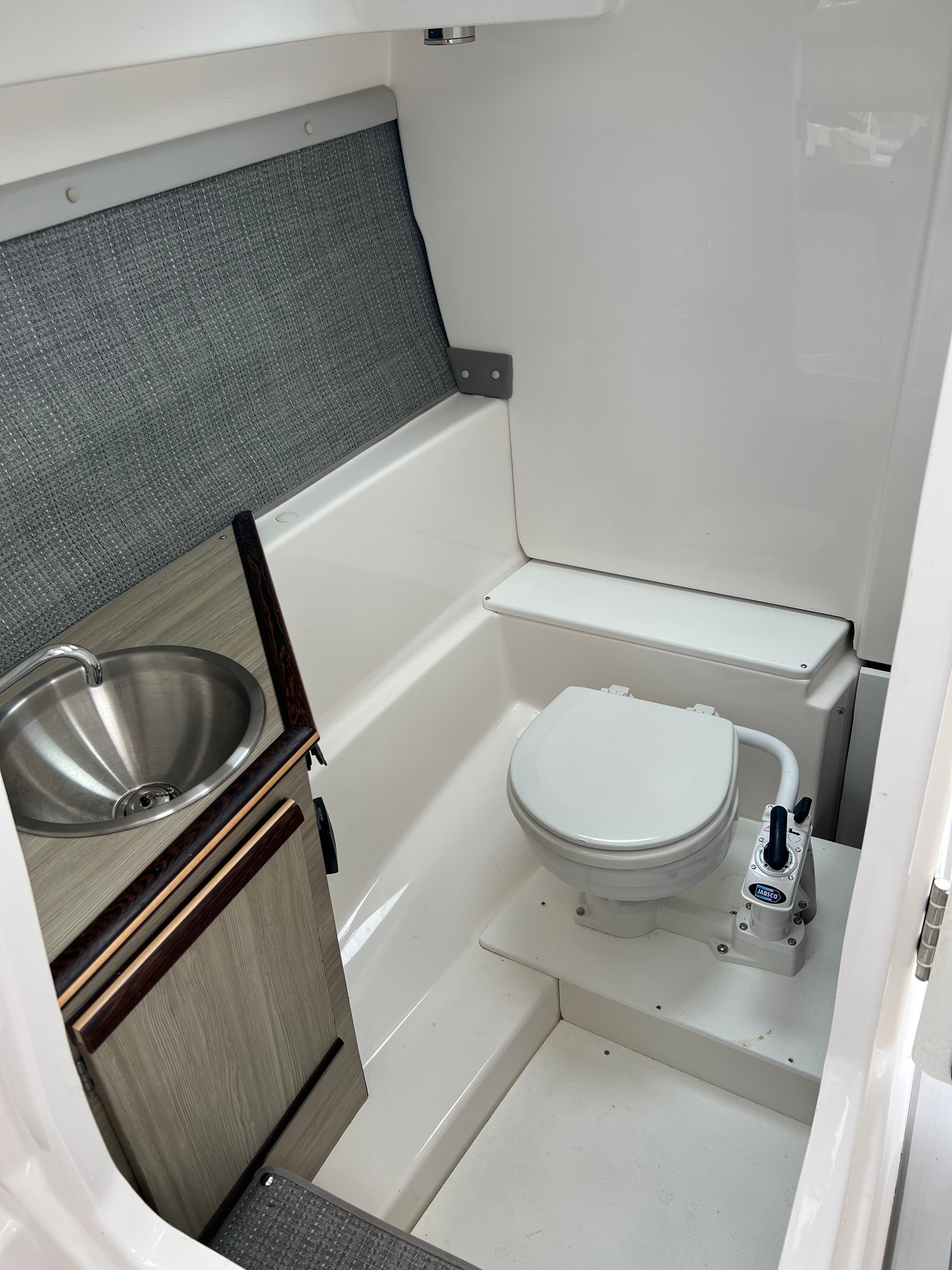 Interior of 2023 Solara S 250DC with toilet and sink.