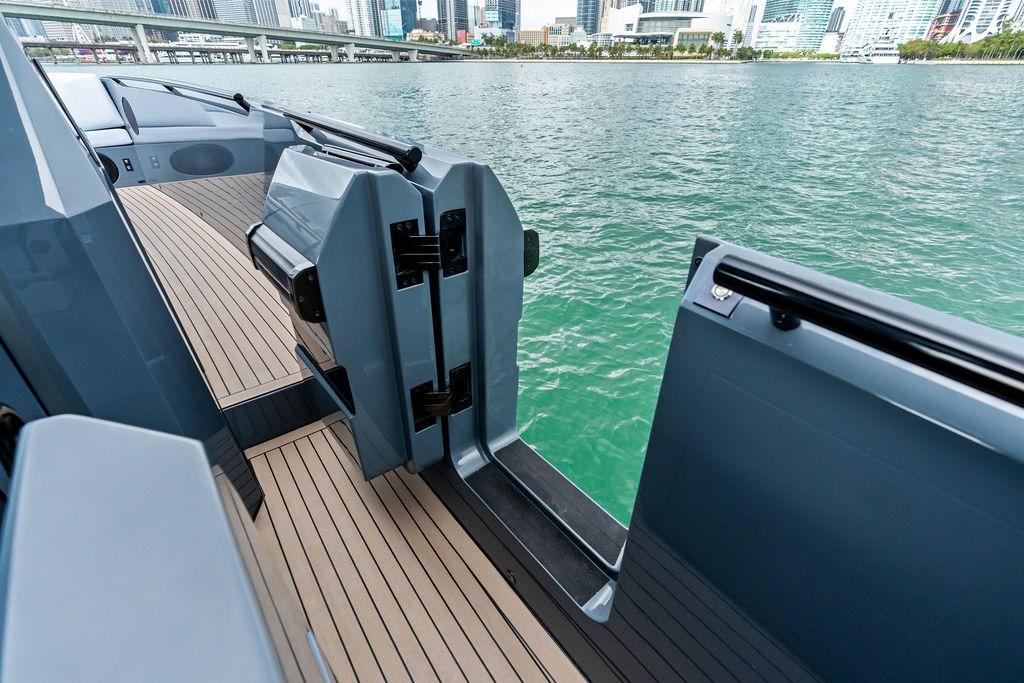2024 Vanquish Yachts VQ55 deck with city skyline and water view.