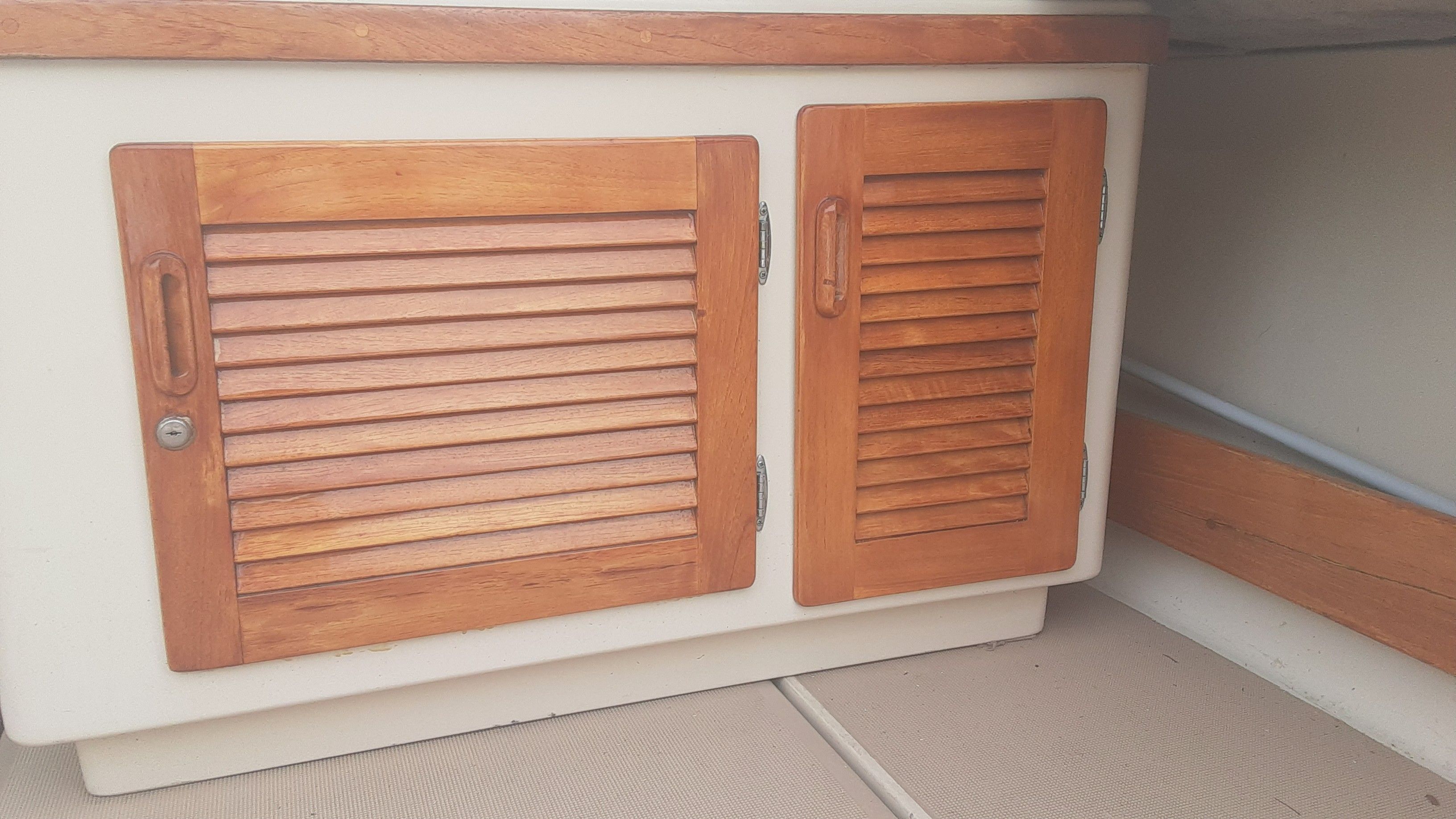 Wooden cabinet doors on a 1985 Tiara Yachts 3100 Open.