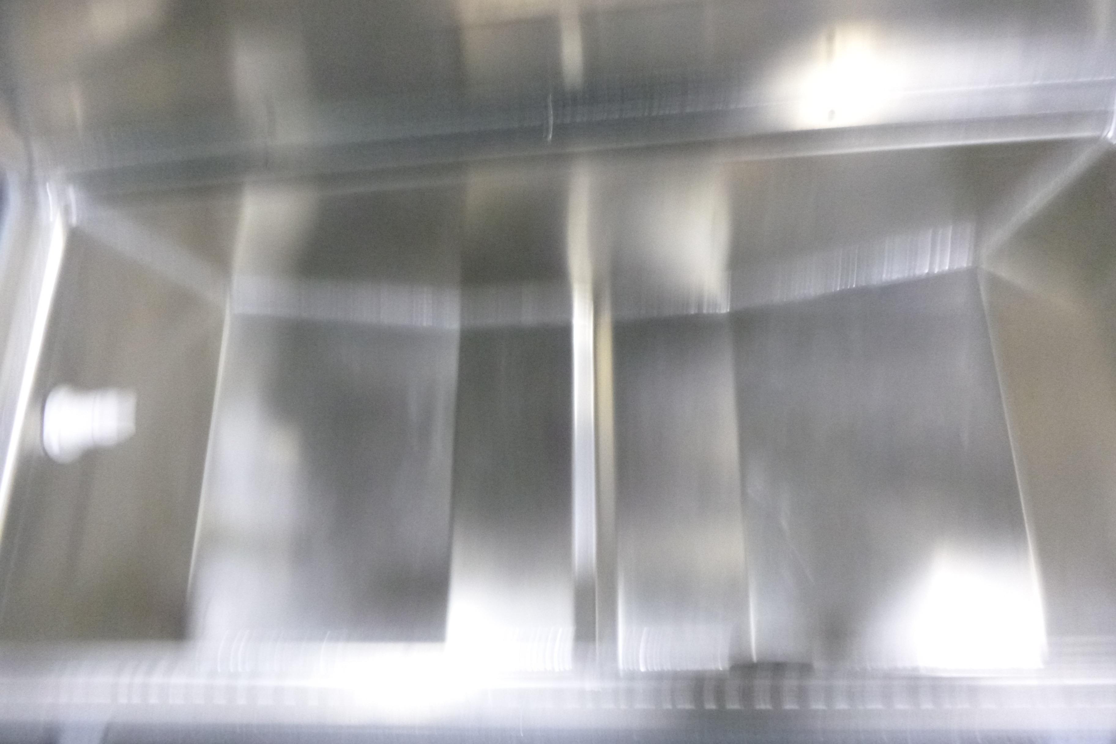 Blurred interior of a KingFisher 2025 Falcon boat, showcasing metallic surfaces.