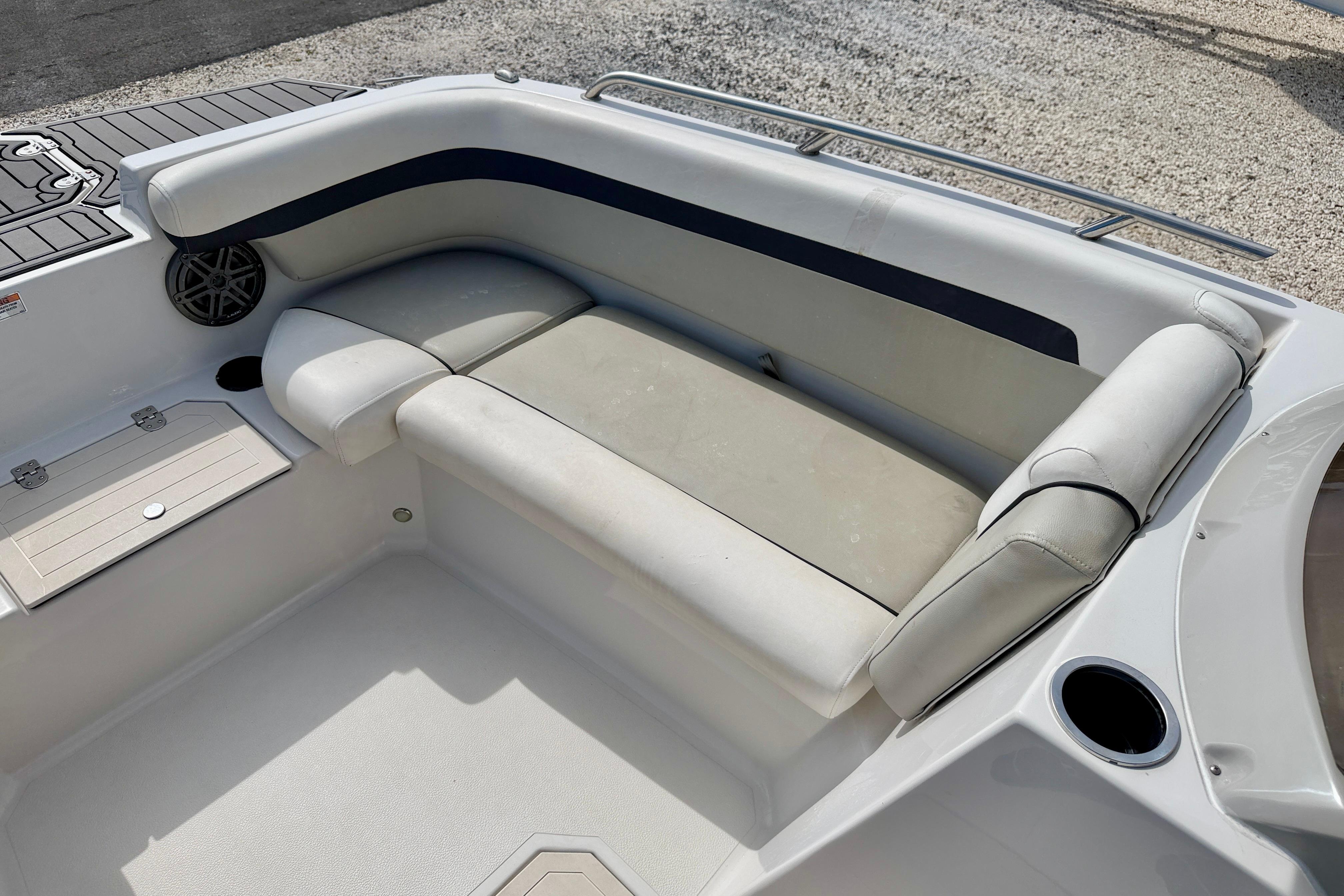2021 Starcraft SVX 191 OB boat interior with cushioned seating and storage compartments.