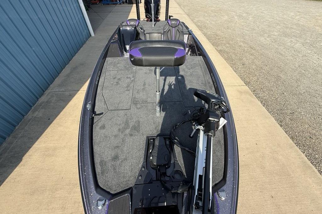 2026 Skeeter ZXE20 fishing boat with trolling motor and seating, docked on concrete.