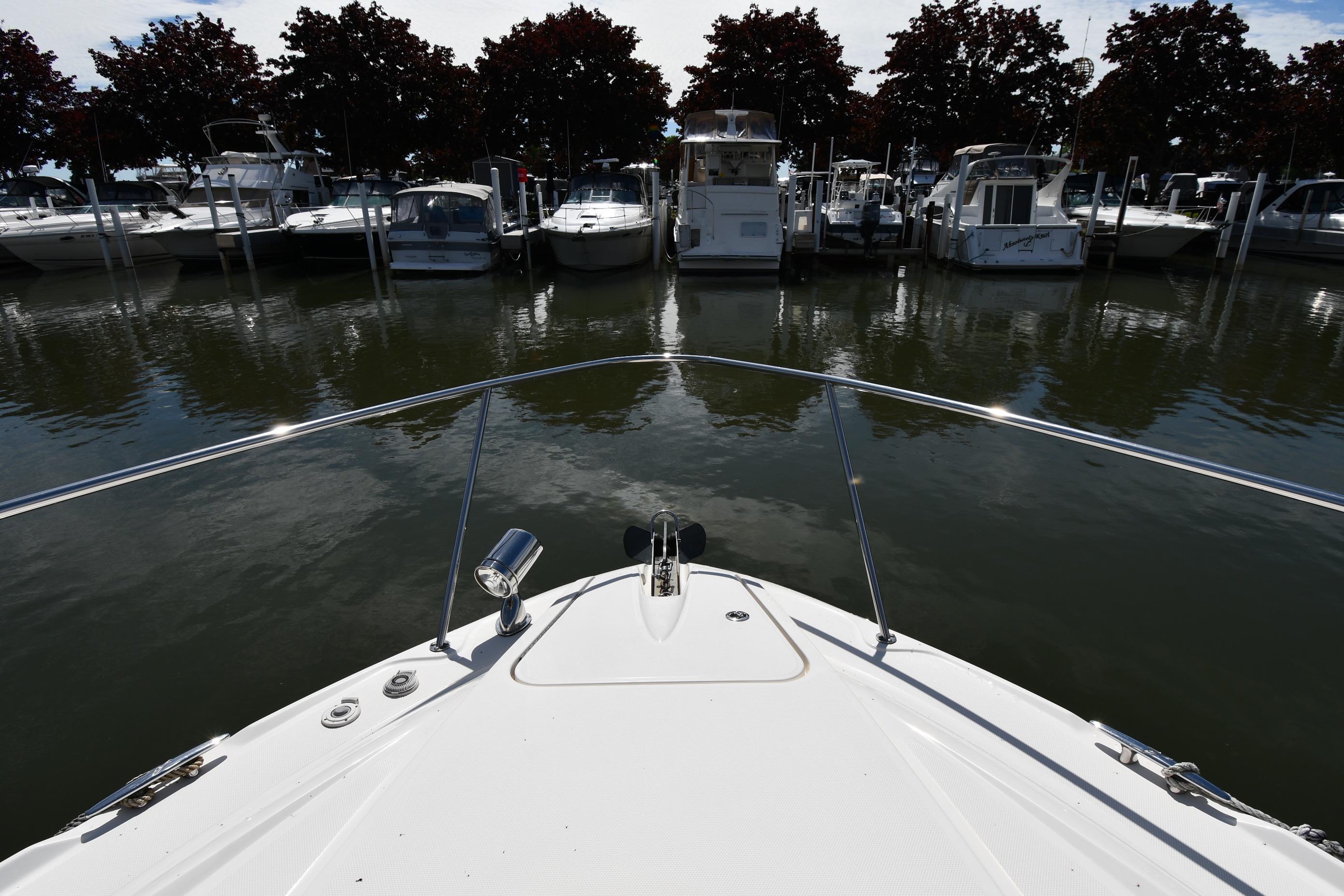 Bow view of 2008 Sea Ray Sundancer 350 docked at marina.
