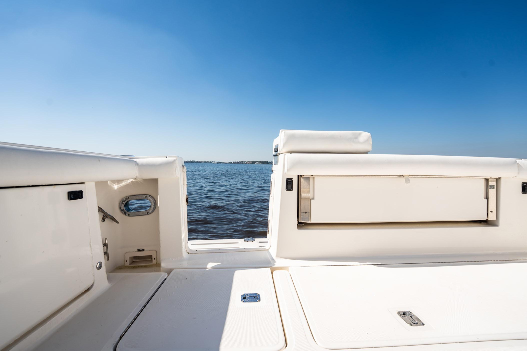 2002 Tiara Yachts 4100 Open boat deck with ocean view under clear blue sky.