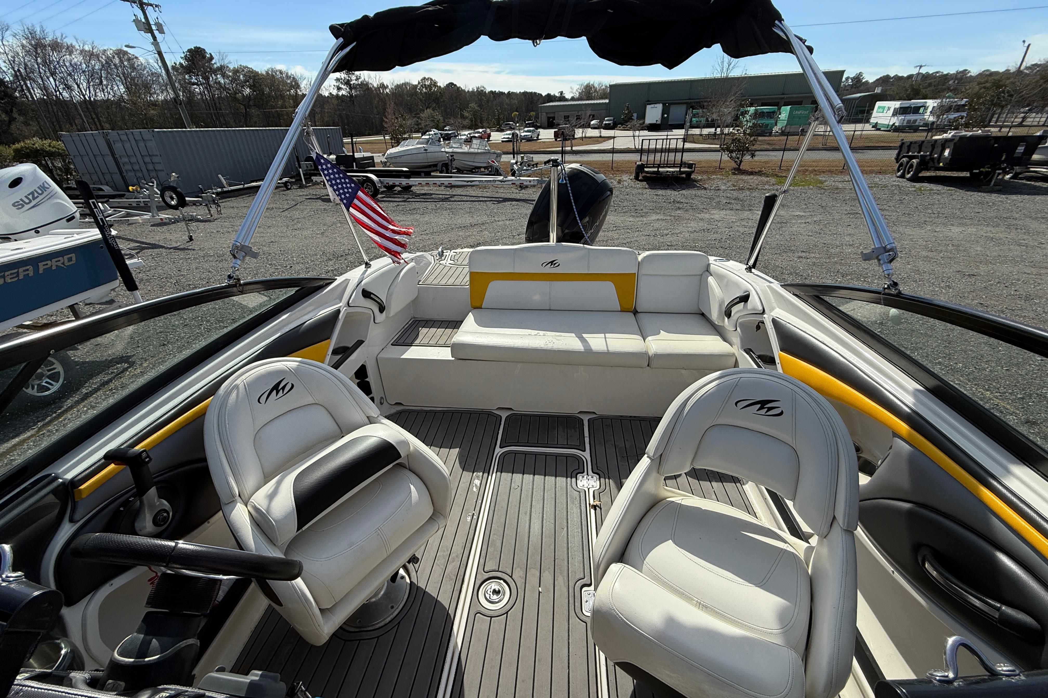 2014 Monterey 197 Blackfin boat interior with seating and American flag displayed.