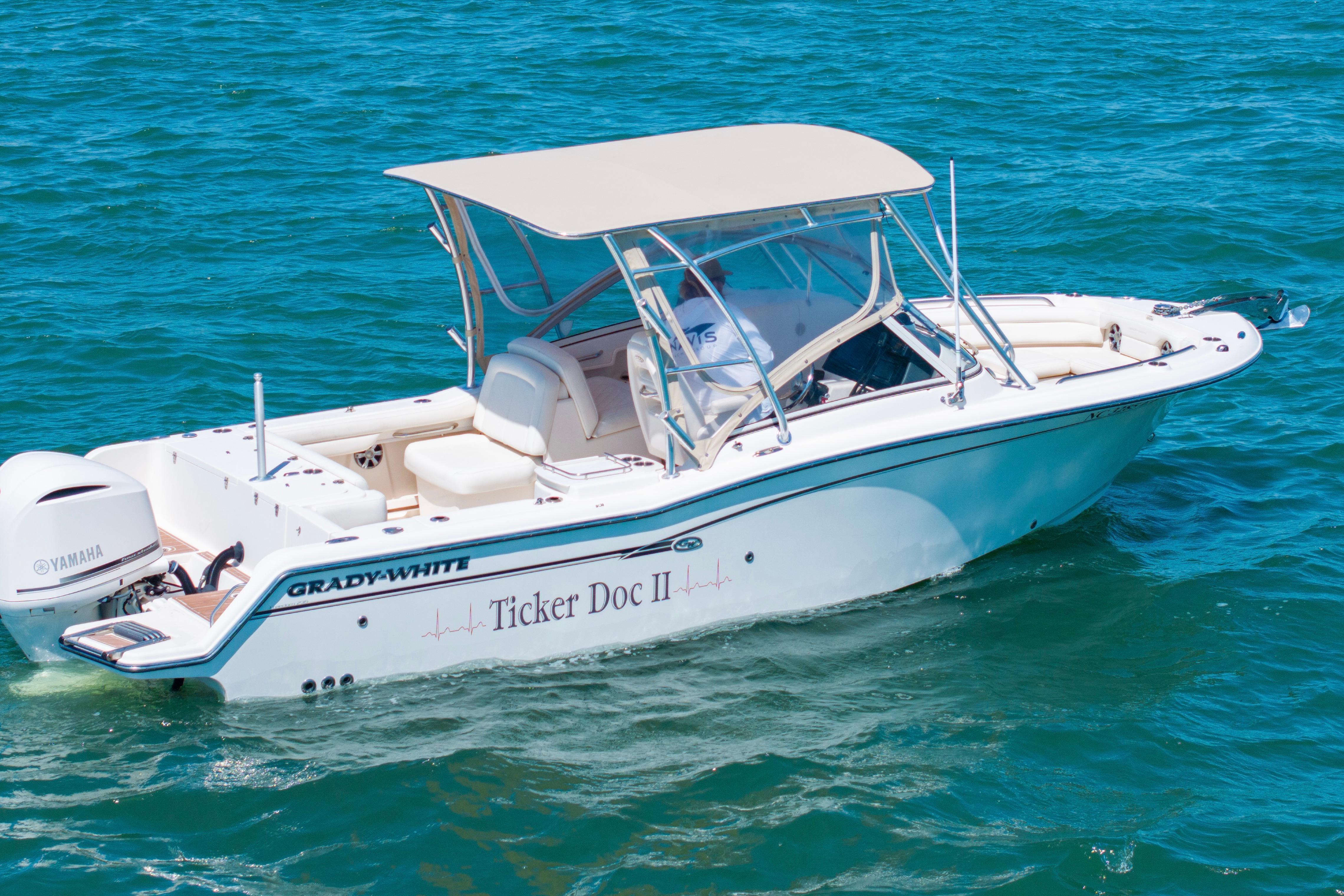 2017 Grady-White Freedom 235 boat on blue water, featuring Yamaha engine.
