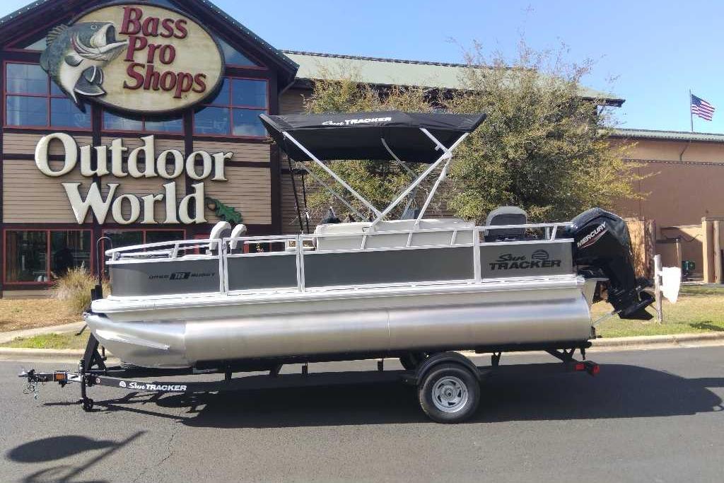 2026 Sun Tracker Bass Buggy 18 DLX pontoon boat outside Bass Pro Shops.