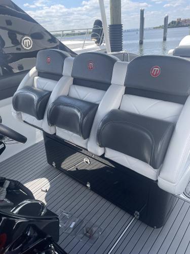 2017 Mystic Powerboats M4200 interior seating with black and white leather upholstery.