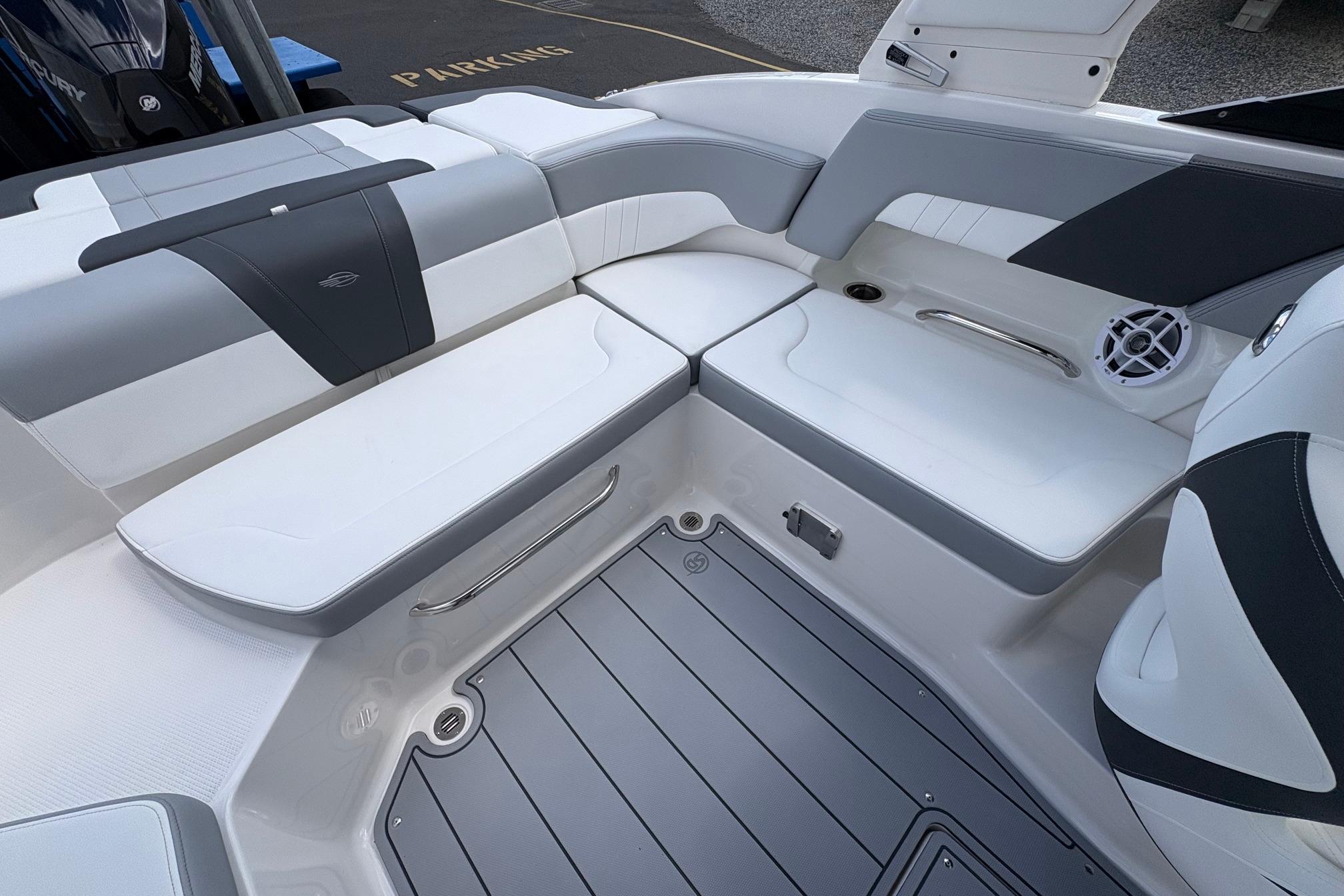 Luxurious seating area on 2026 Chaparral 23 SSi OB boat, featuring sleek design and modern upholstery.