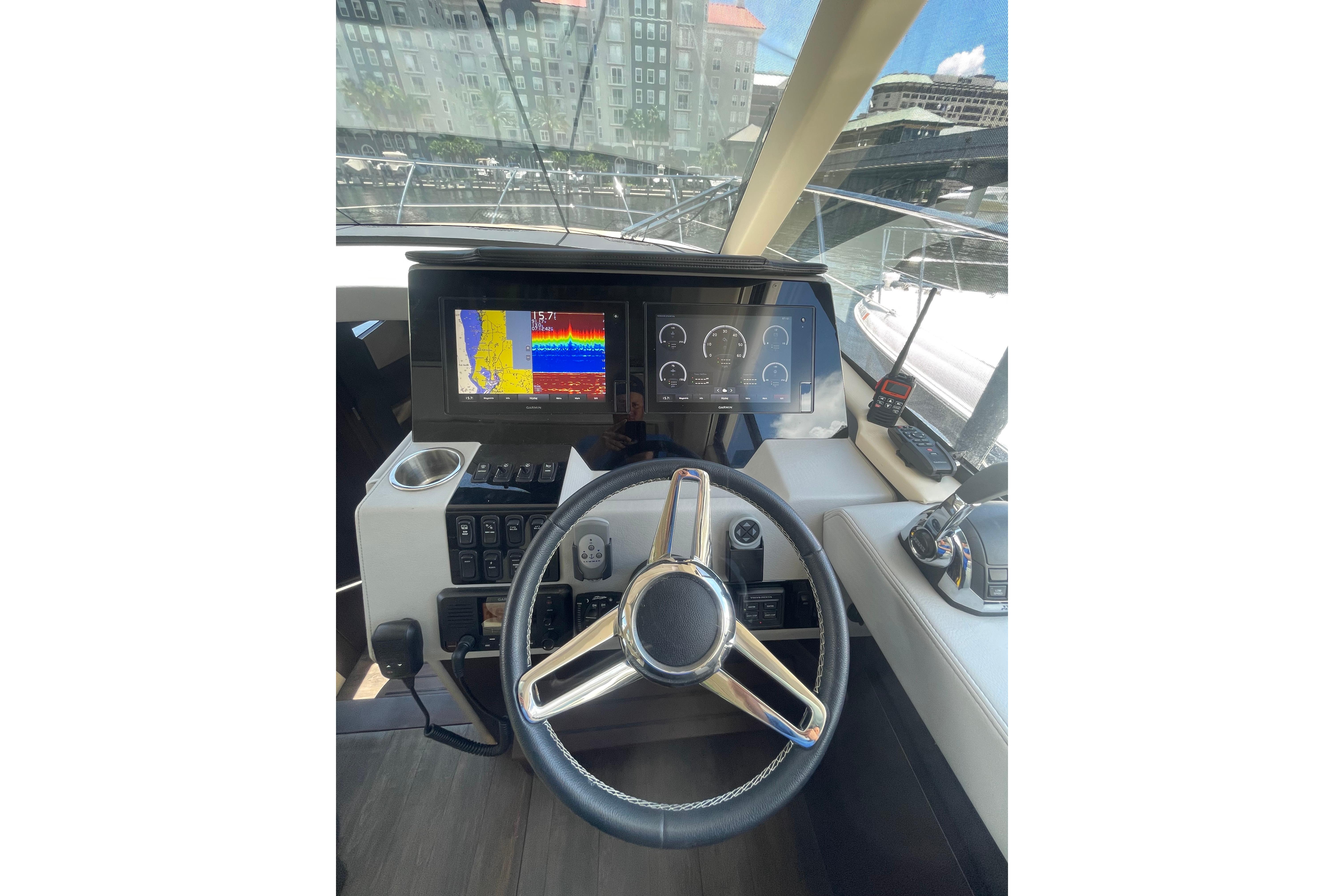 Helm of 2020 Regal 42 Grande Coupe with navigation displays and controls.