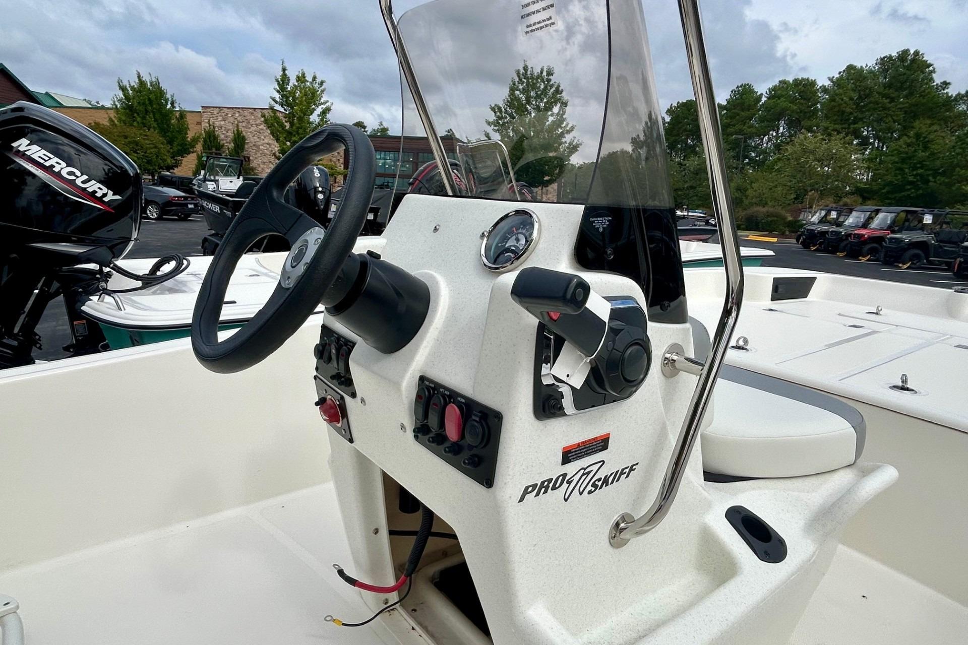 2026 Mako Pro Skiff 17 CC boat console with steering wheel and controls.