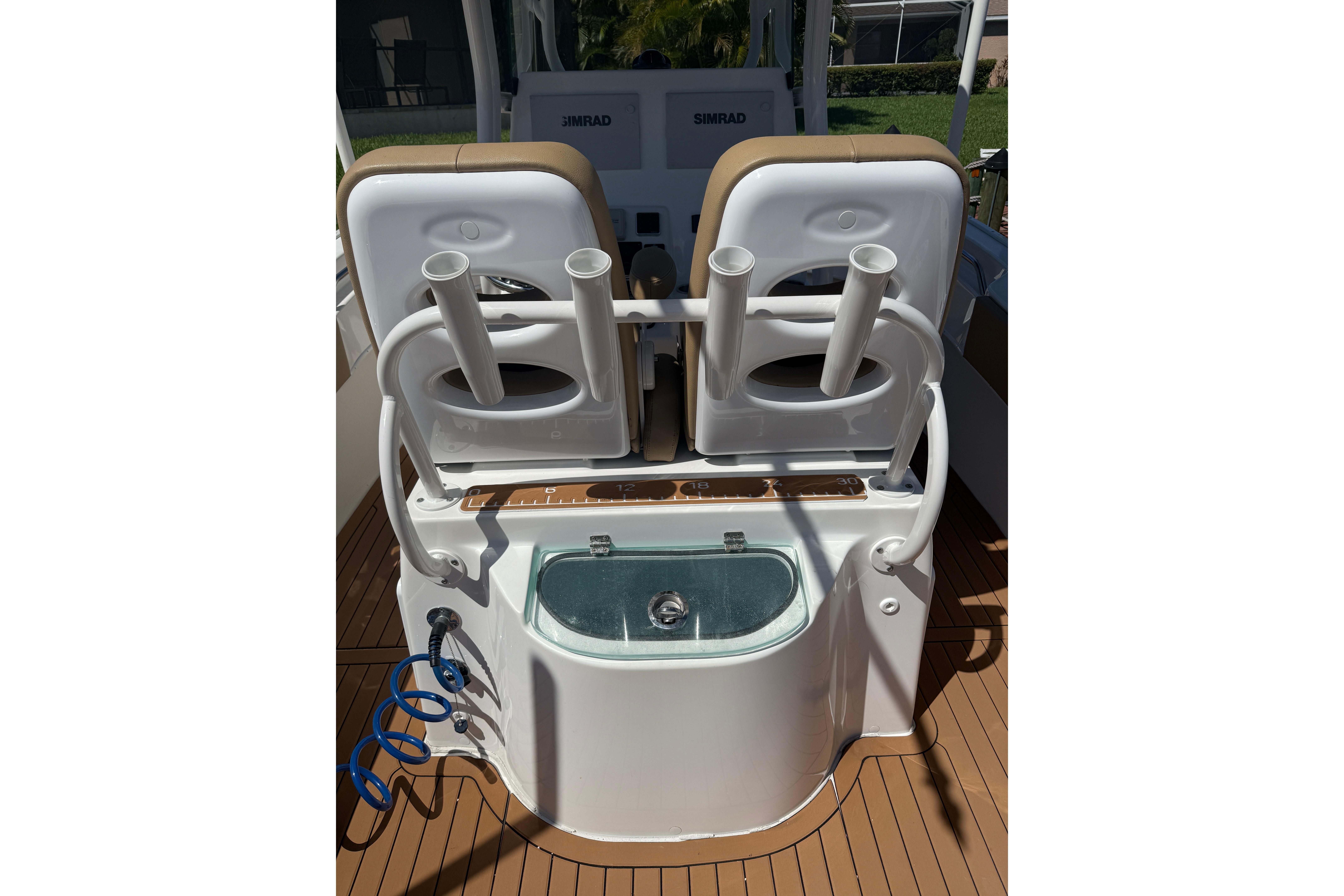 2019 Cape Horn 27XS boat interior with rod holders and livewell on deck.