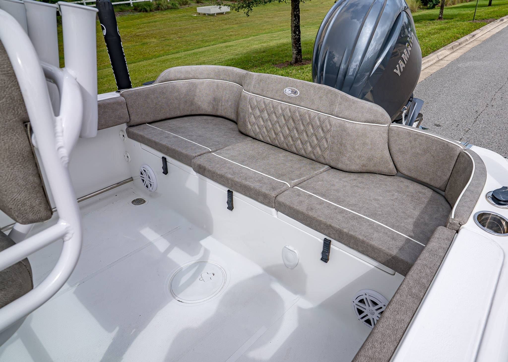 2026 Sea Hunt Ultra 229 boat interior with cushioned seating and Yamaha engine.
