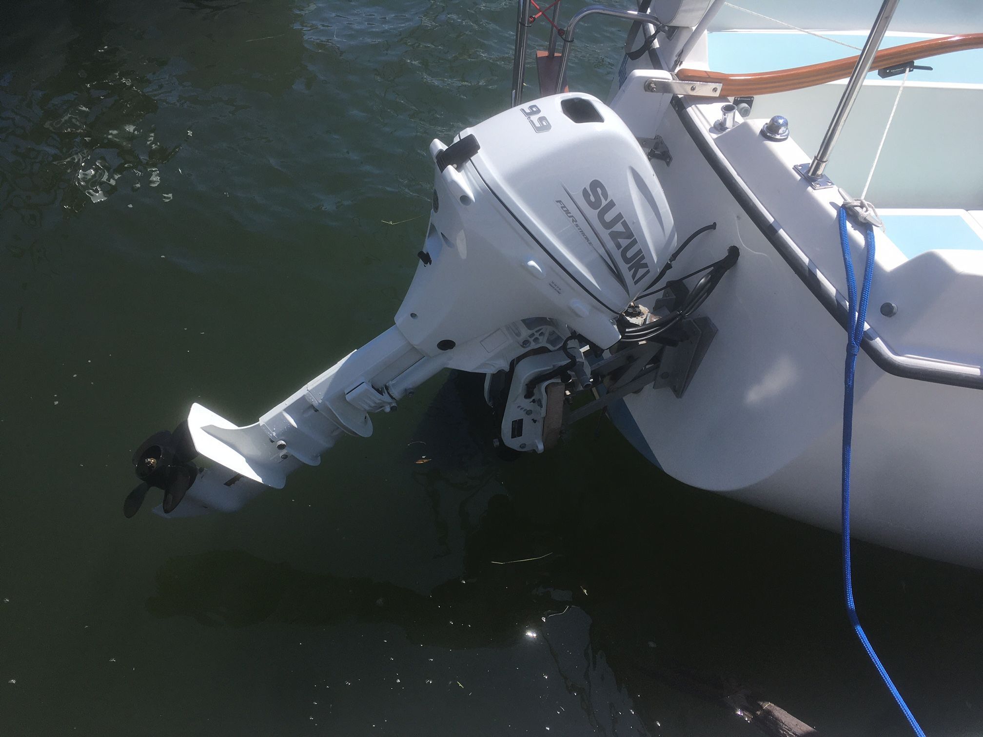 Suzuki outboard motor mounted on 1975 O'Day Sloop.