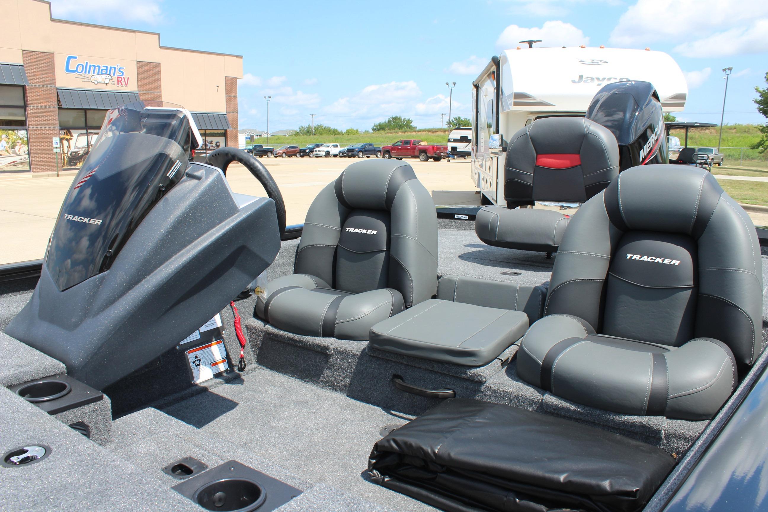 2026 Tracker Pro Team 175 boat interior with gray seating and steering console.