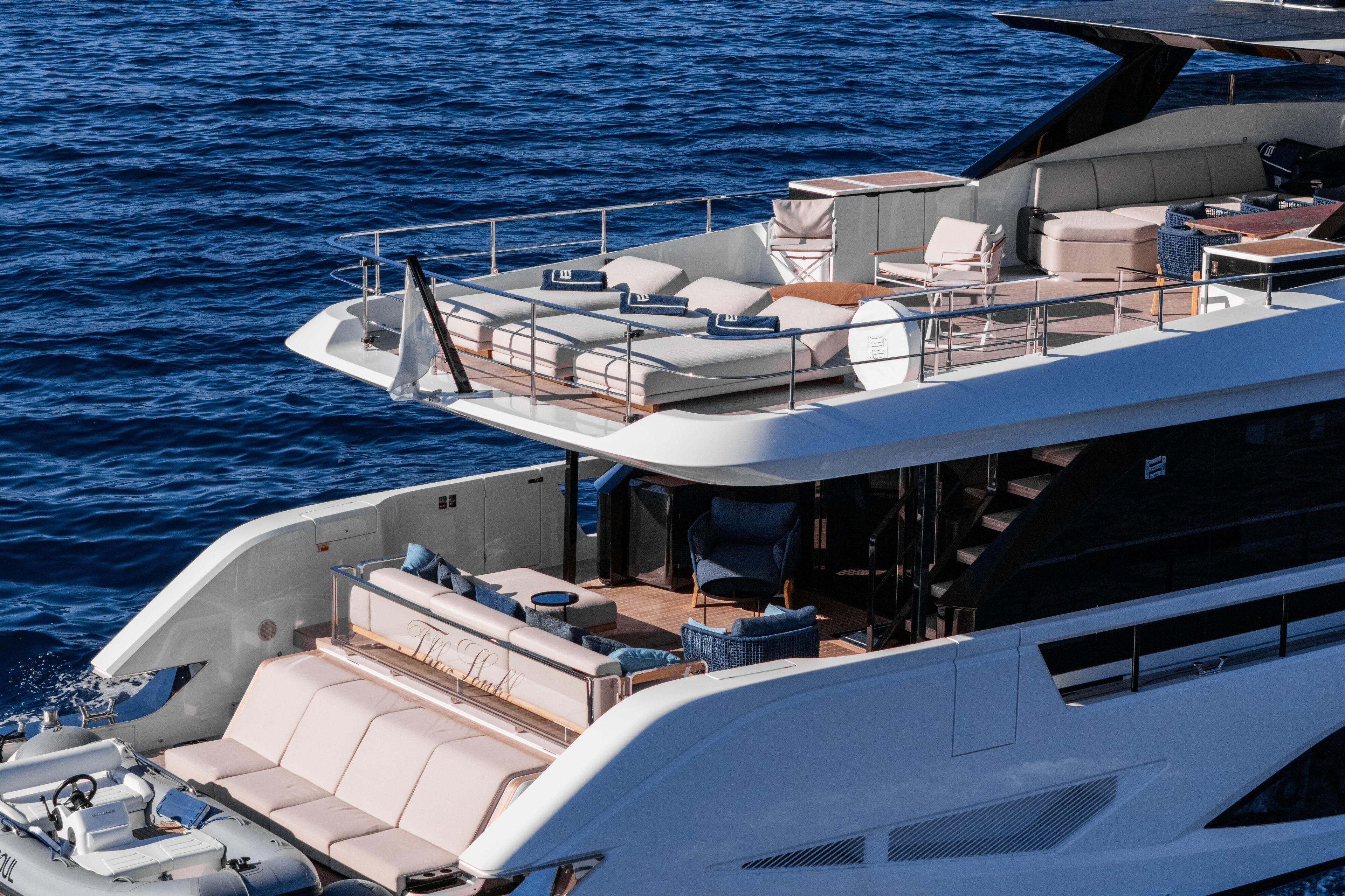 Luxurious 2025 Ferretti Yachts INFYNITO 80 cruising on open sea, showcasing elegant design.