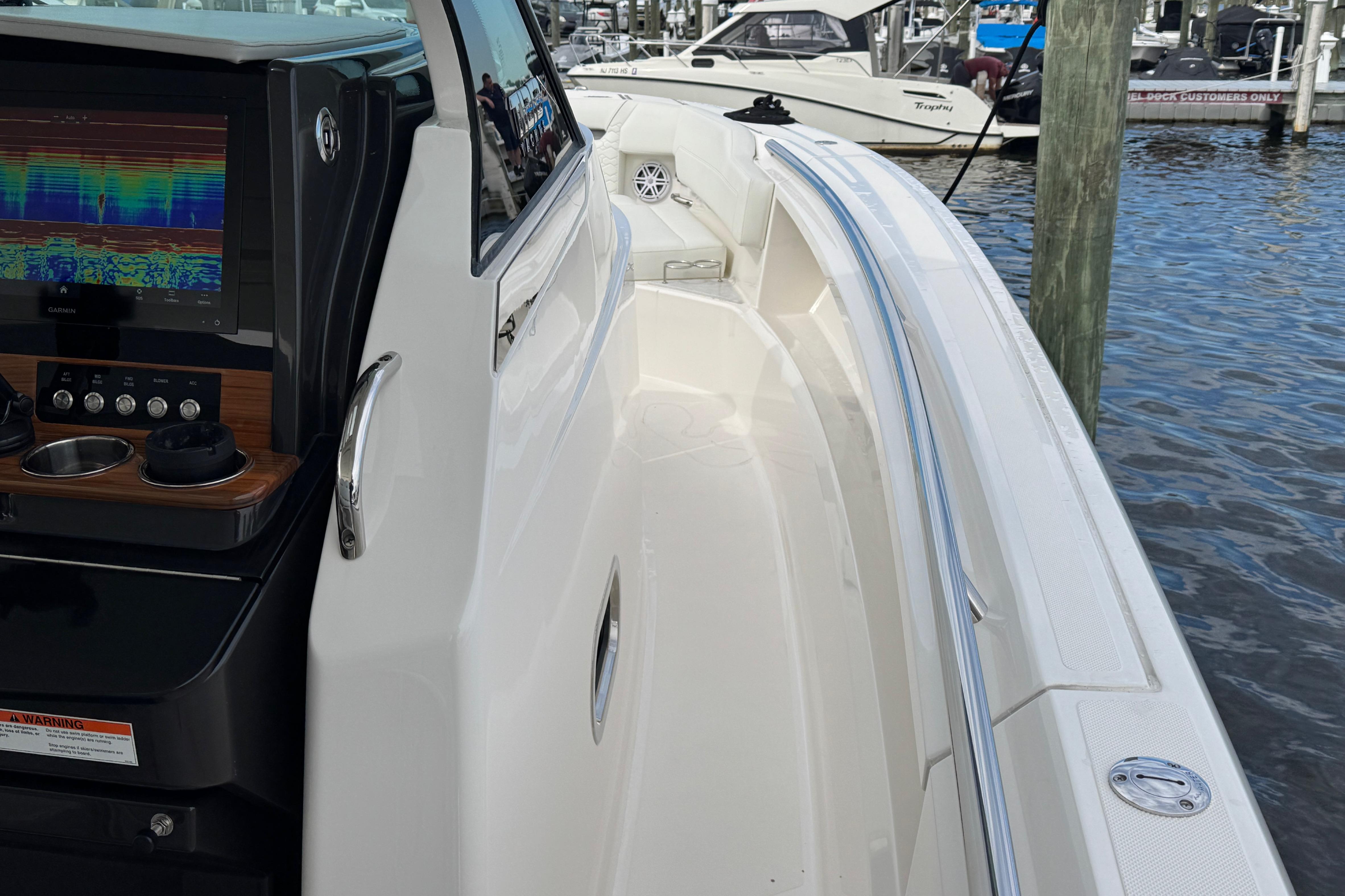 2023 Tiara Yachts 43 LS boat with sleek design and advanced navigation system.
