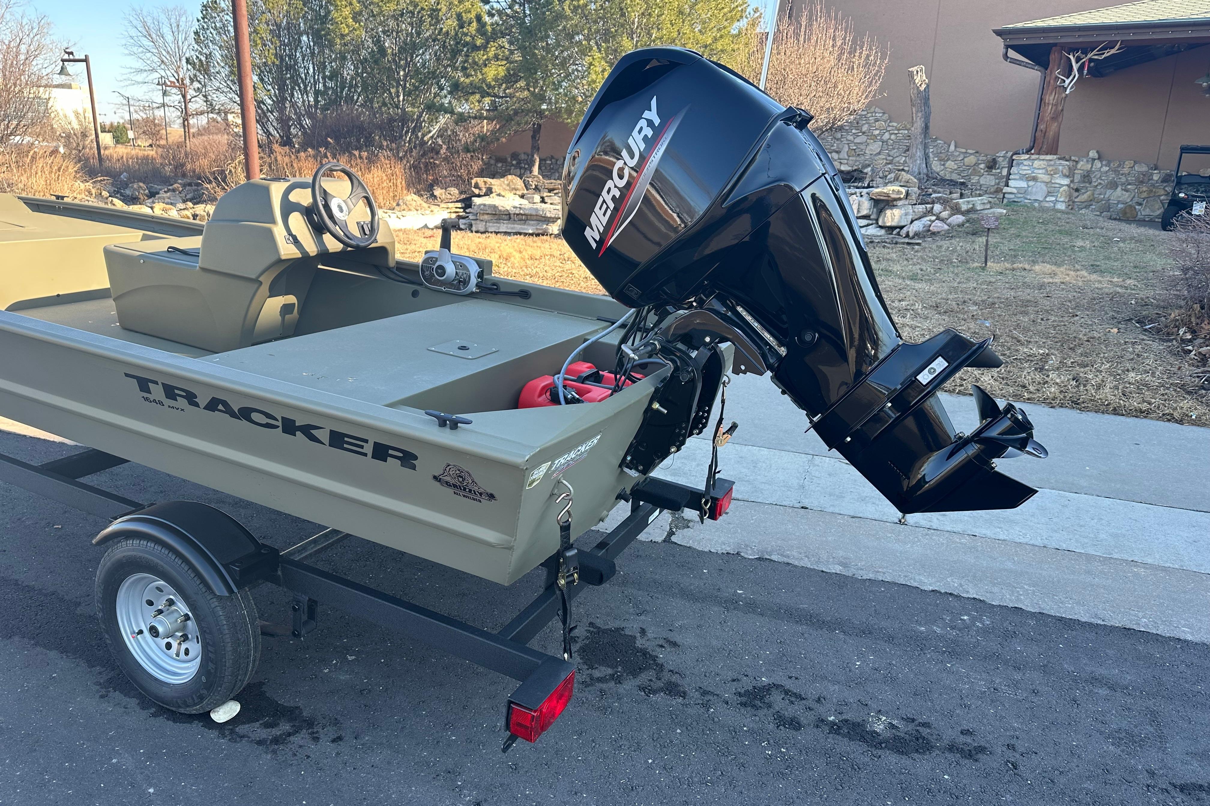 2026 Tracker Grizzly 1648 SC boat with Mercury outboard motor on trailer.