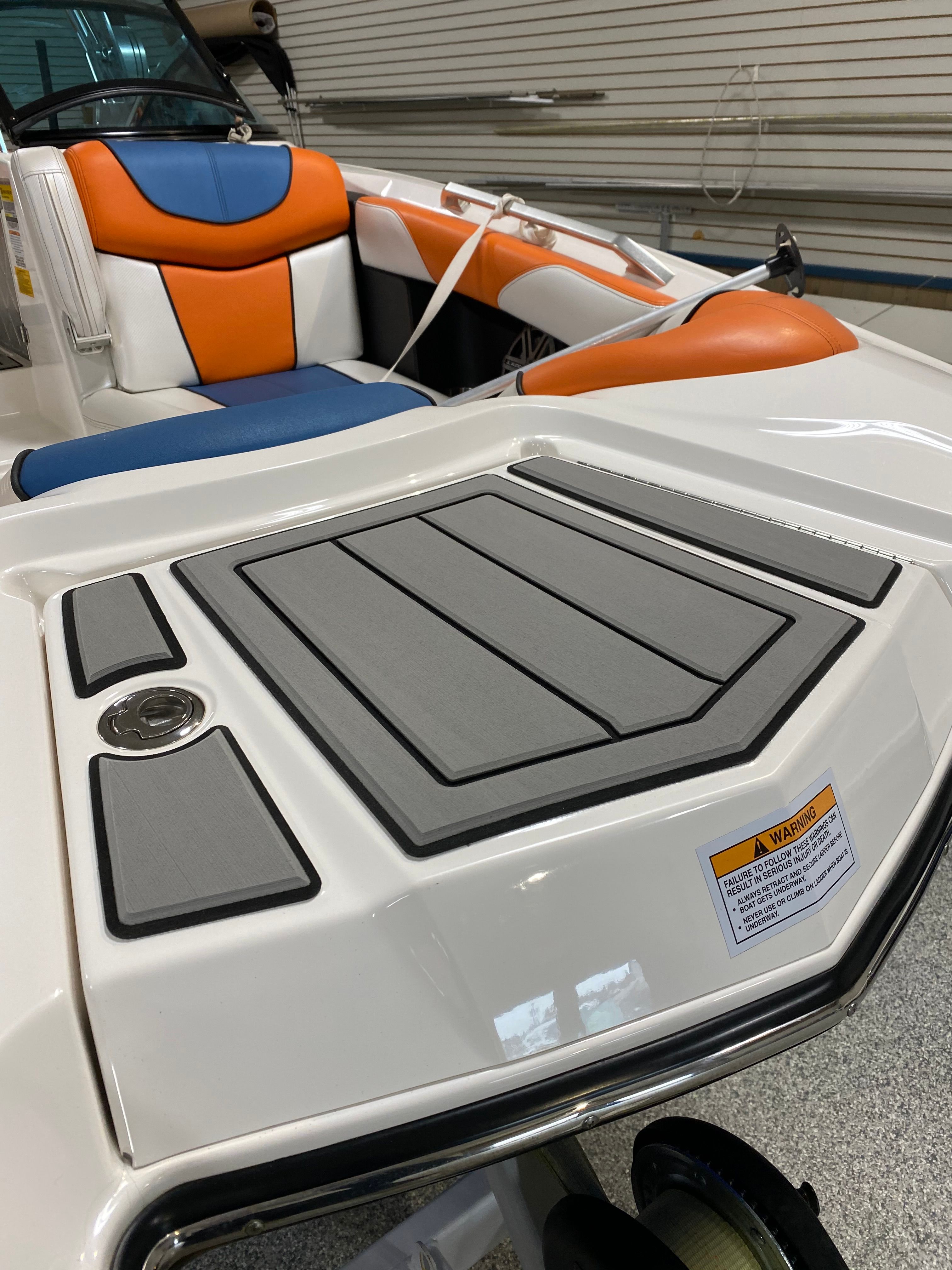 Interior of a 2013 MasterCraft XStar with colorful seating.