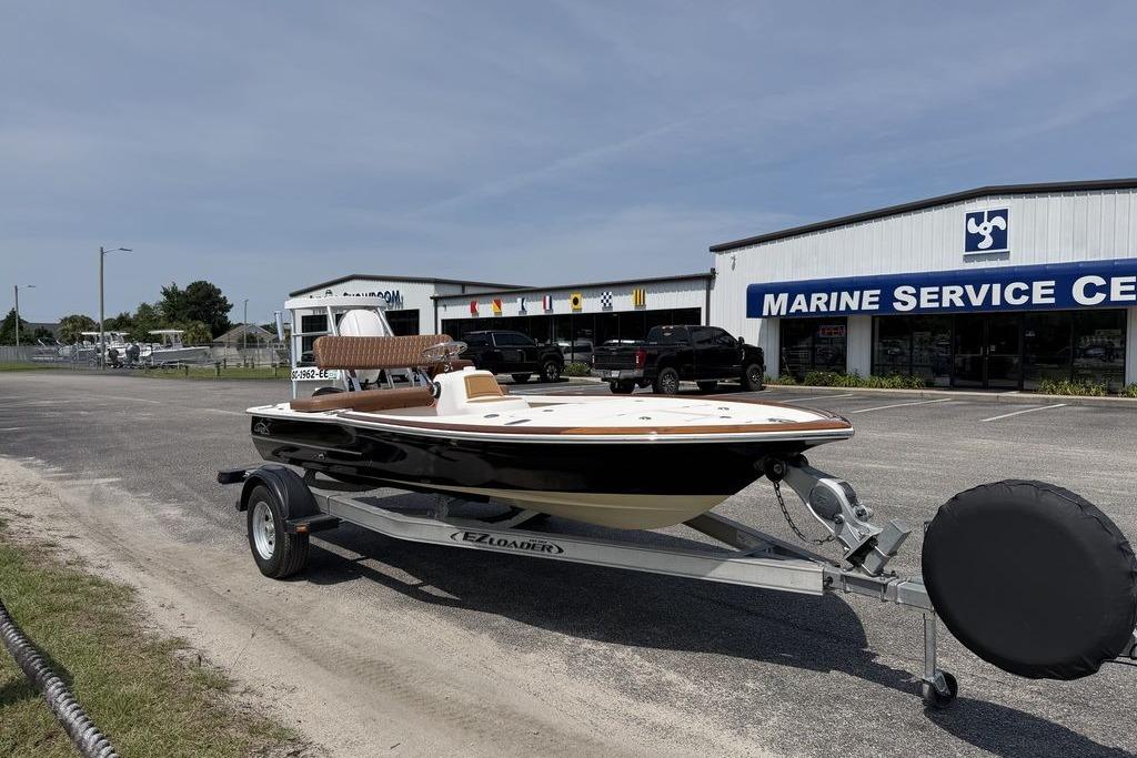 2012 Chaos 16 Bonefish boat on trailer outside Marine Service Center.