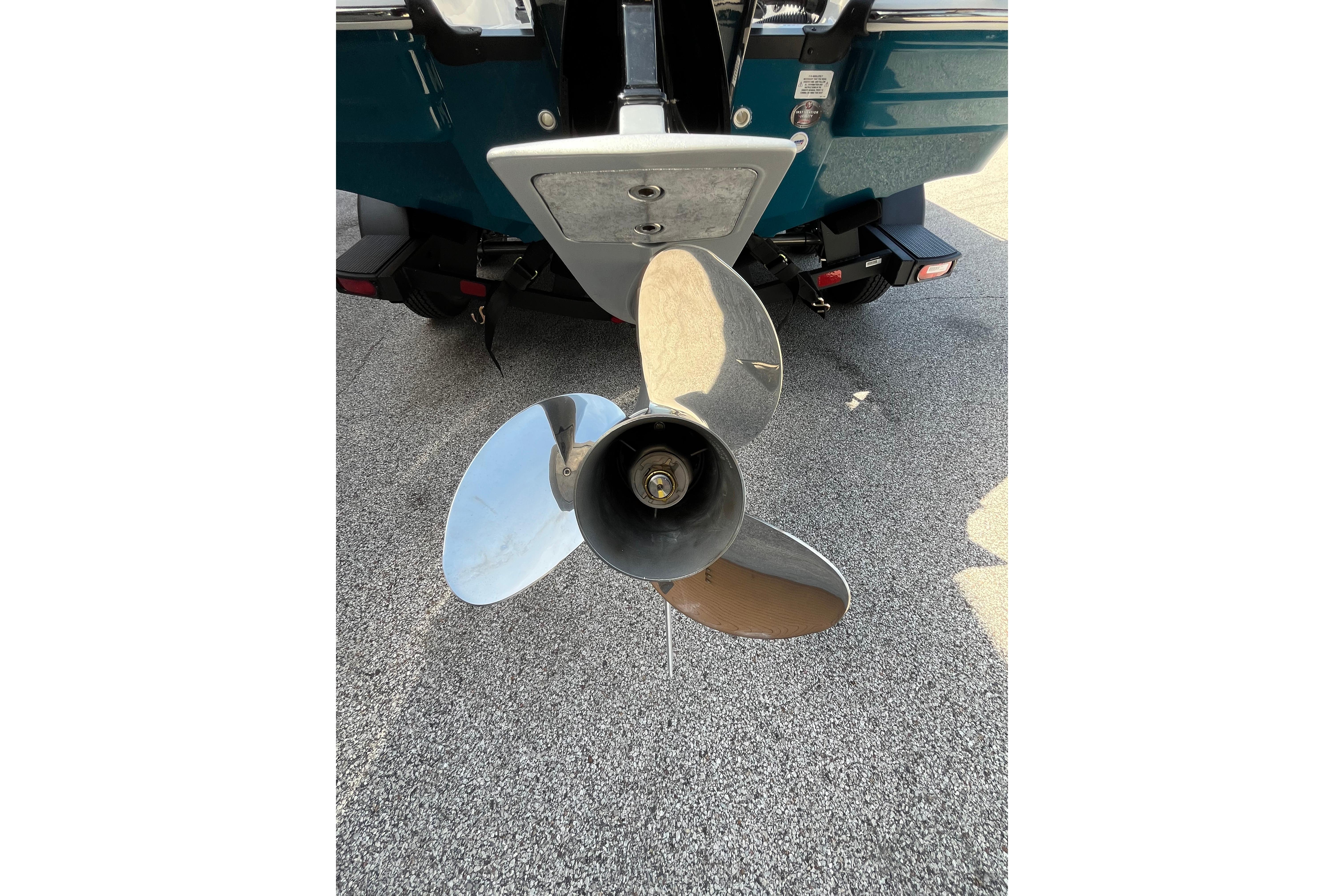 Close-up of a Tahoe 1950 boat propeller, 2026 model, on a textured surface.