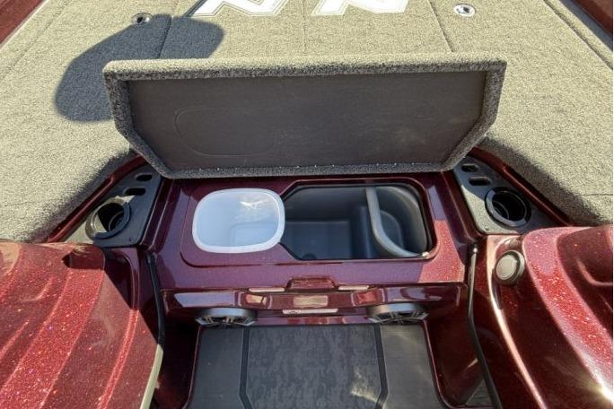 2026 Nitro Z21 XL Pro boat storage compartment with open lid and cup holders.