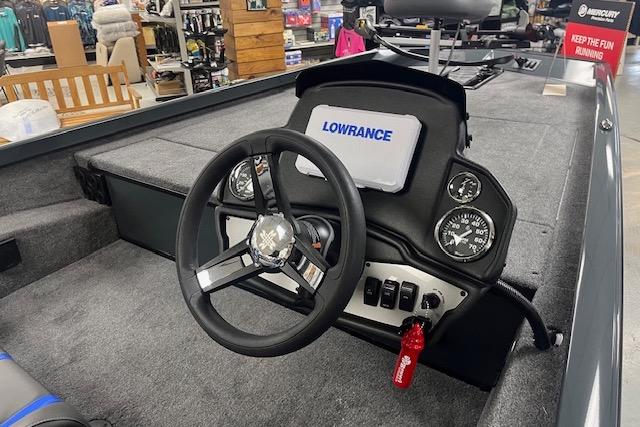 2026 Ranger RT188 boat dashboard with Lowrance display and steering wheel in showroom.