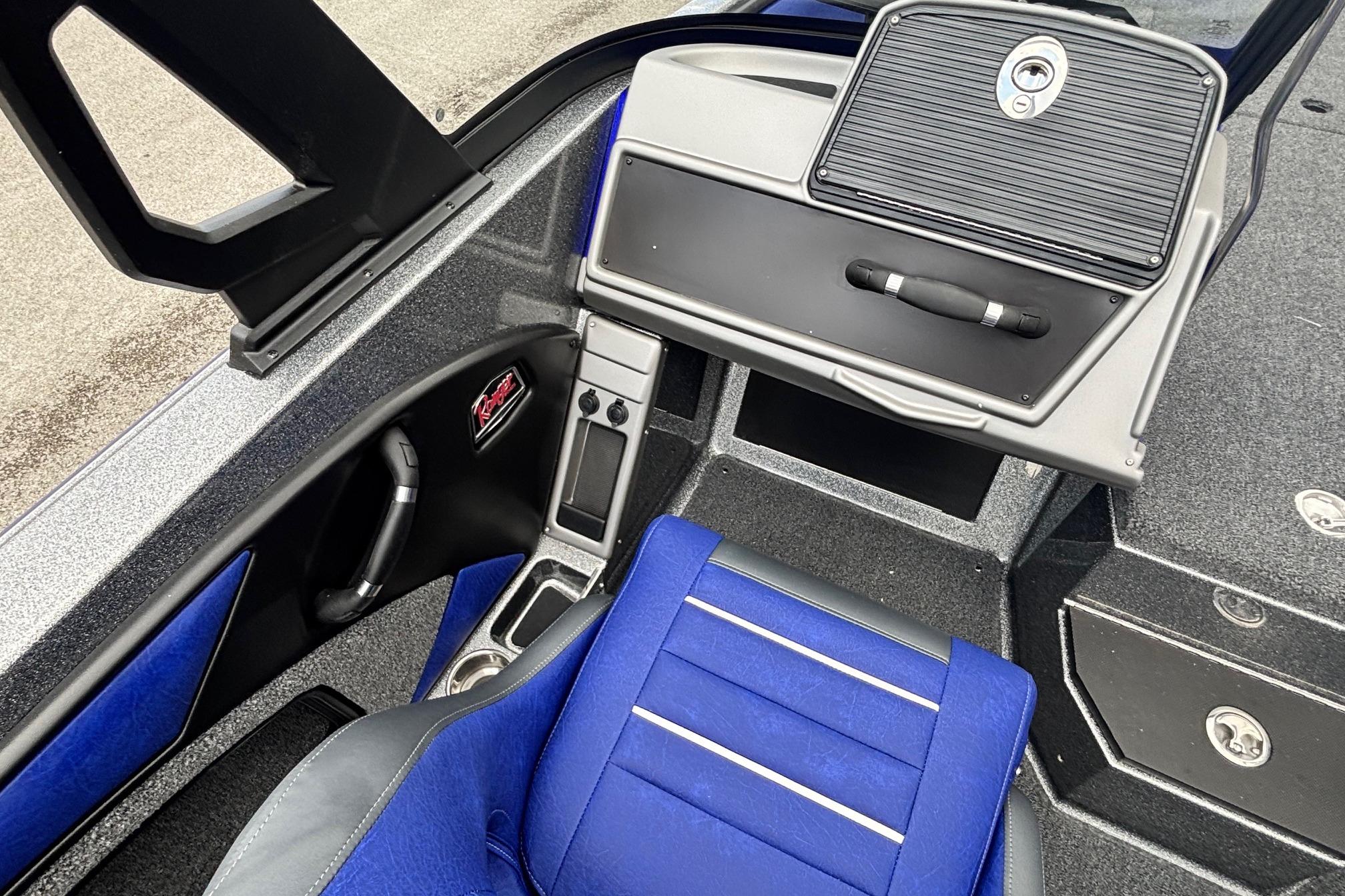 Interior of 2026 Ranger 1880MS A Pack Equipped boat with blue seating and storage compartments.