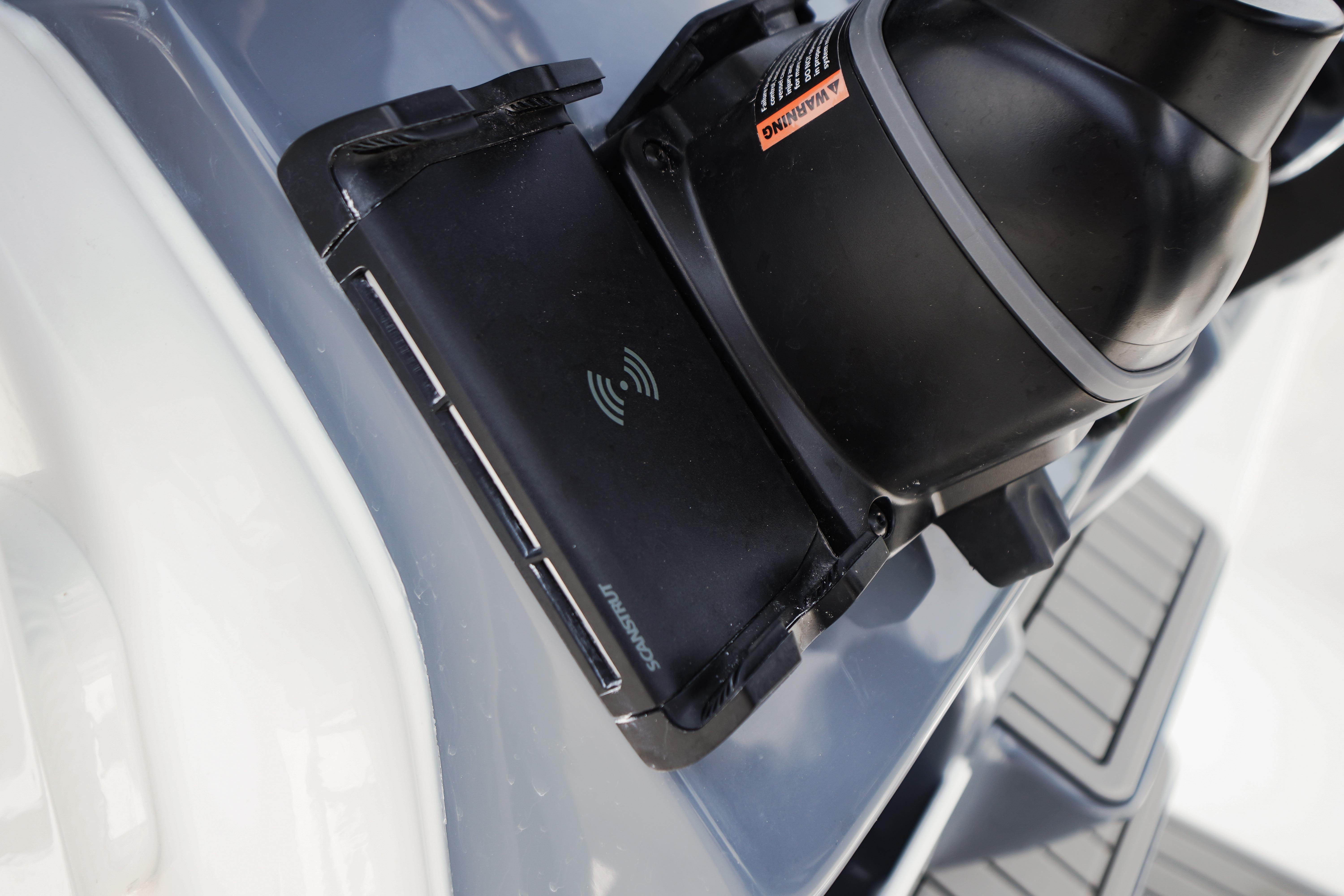 Close-up of a 2027 Tidewater 220 CC Adventure boat's wireless charging pad.