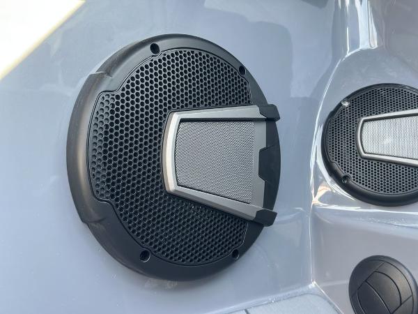 Close-up of Axis A225 2025 model speaker grille on a sleek surface.
