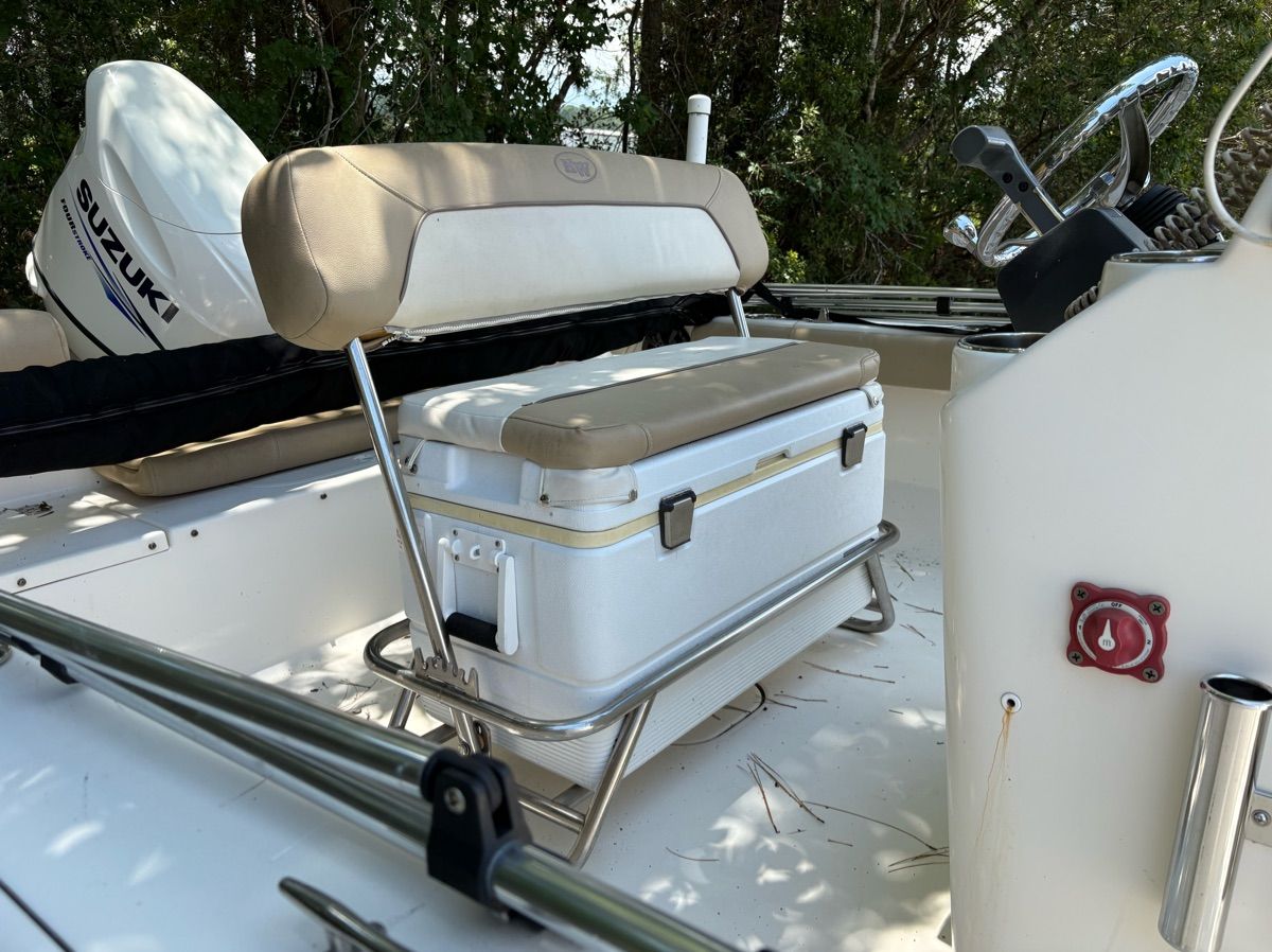 The image shows the cockpit of a 2016 Key West 189 FS boat with a bench seat and helm.
