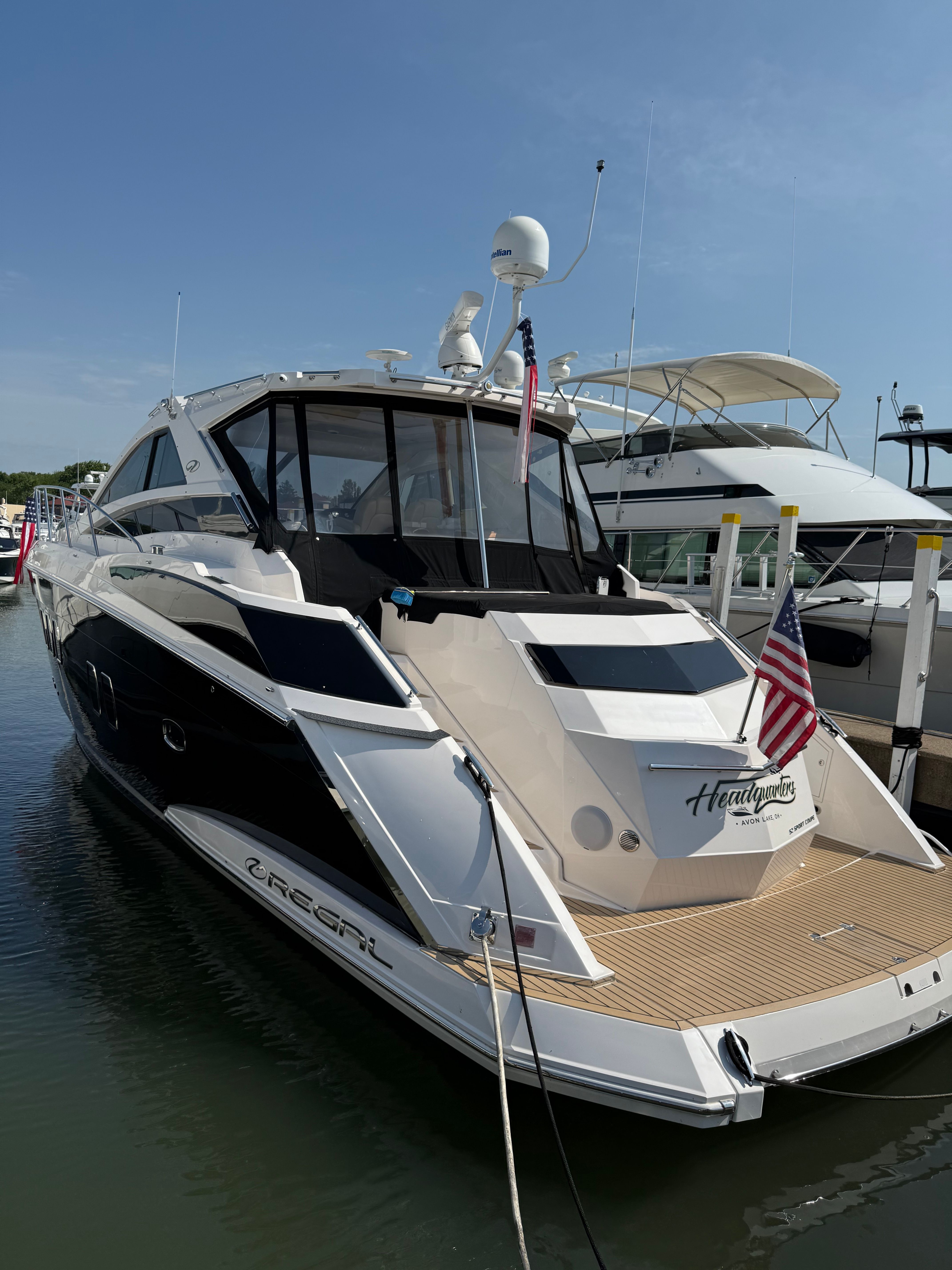 2010 Regal 52 Sport Coupe yacht docked at marina.