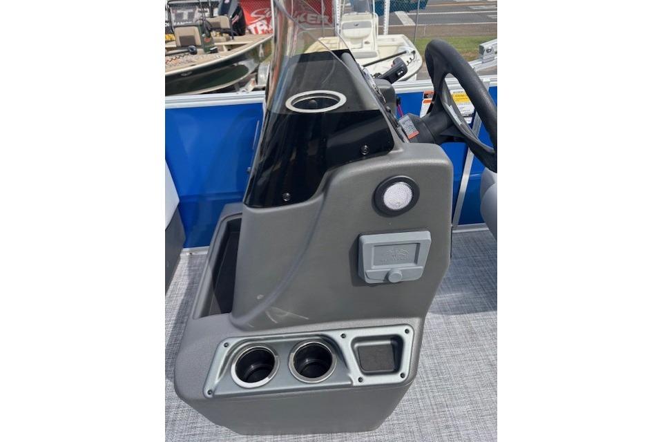 2026 Sun Tracker Party Barge 16 DLX console with steering wheel and cup holders.