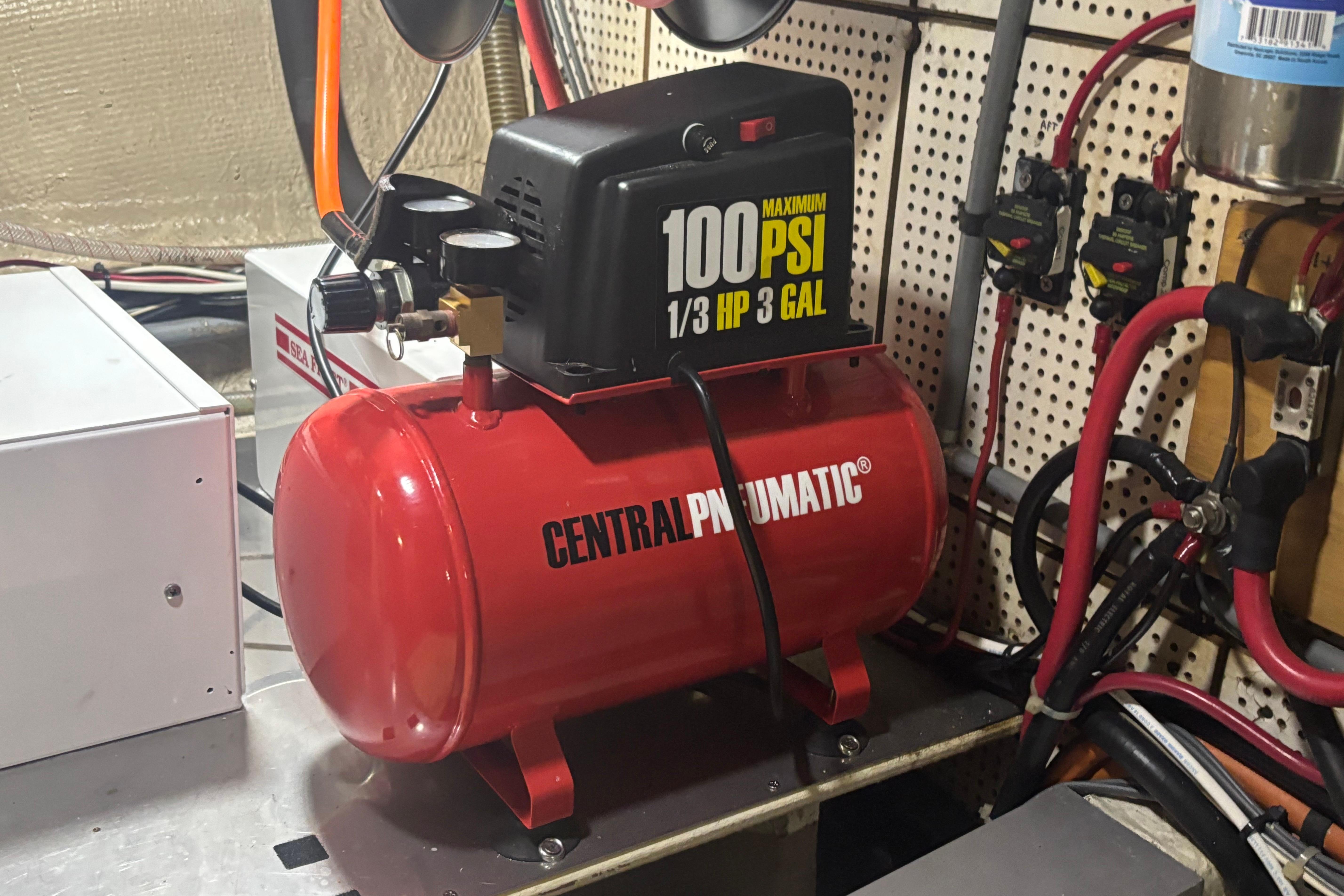 Red Central Pneumatic air compressor in a 1989 Grand Banks 46 Classic engine room.