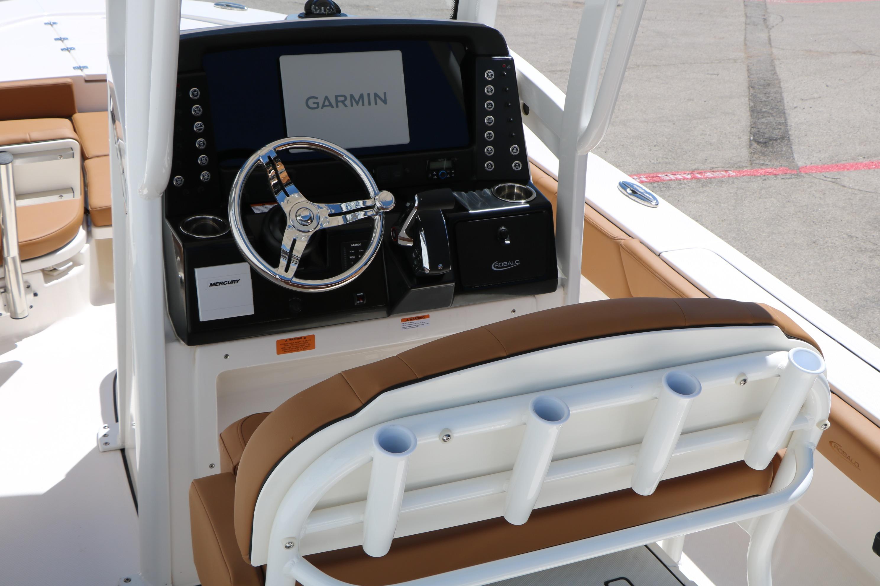 2026 Robalo 246 Cayman boat console with Garmin display and steering wheel.
